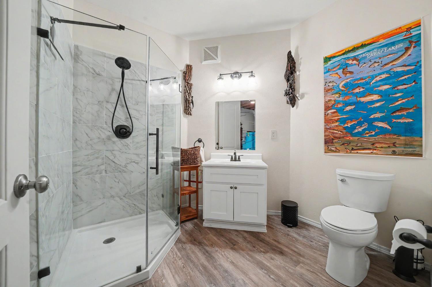 6066 Bluff View Road Copperopolis, CA 95228 - Photo 72 of 96 a bathroom with a toilet sink and shower