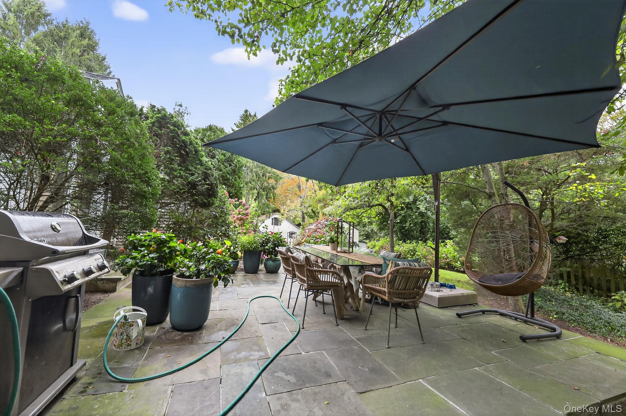 20 Old Mt Kisco Road Armonk, NY 10504 - Photo 1 of 50 a view of a patio with furniture and a garden