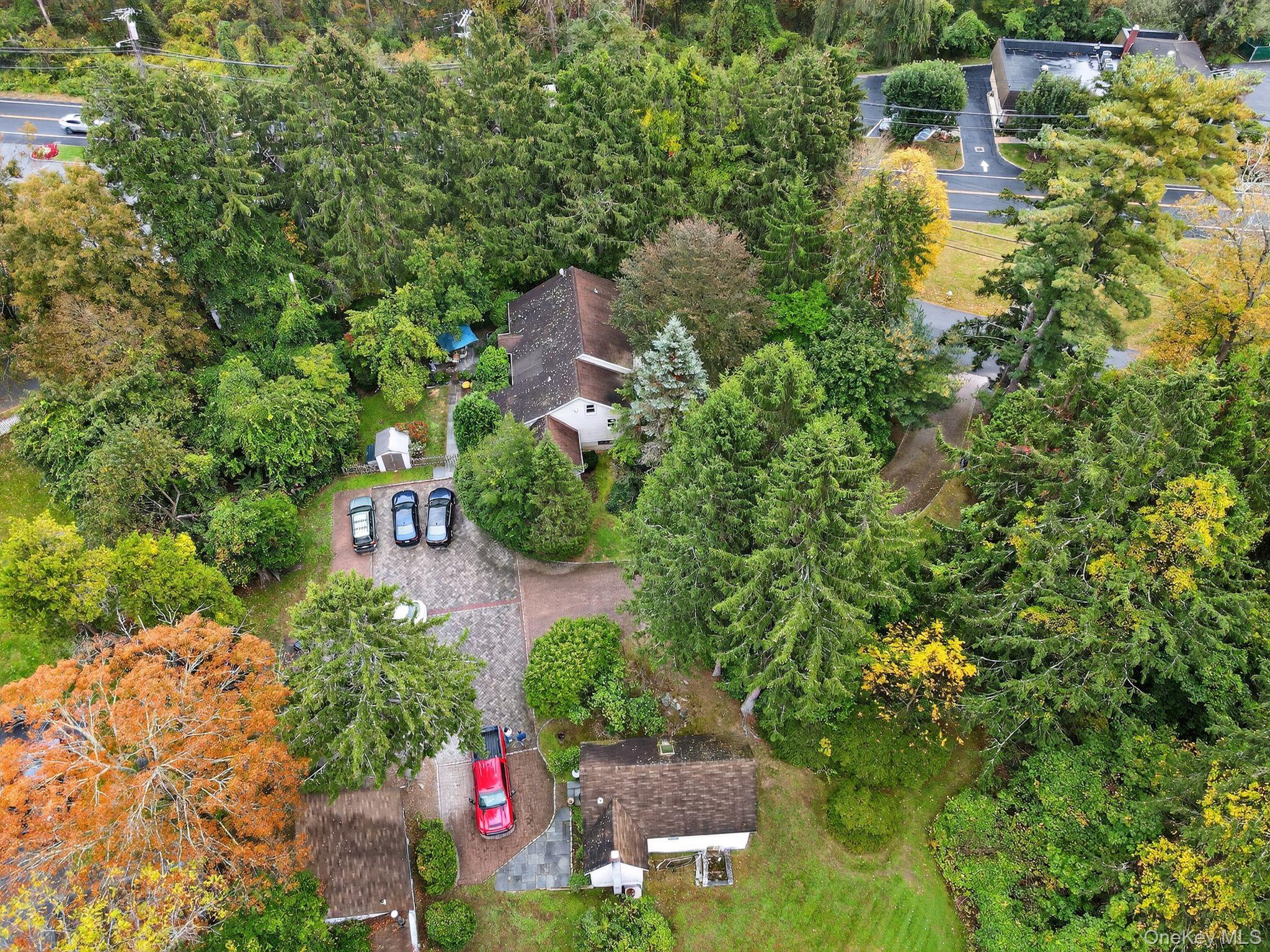 20 Old Mt Kisco Road Armonk, NY 10504 - Photo 11 of 50 an aerial view of residential house with outdoor space and trees all around