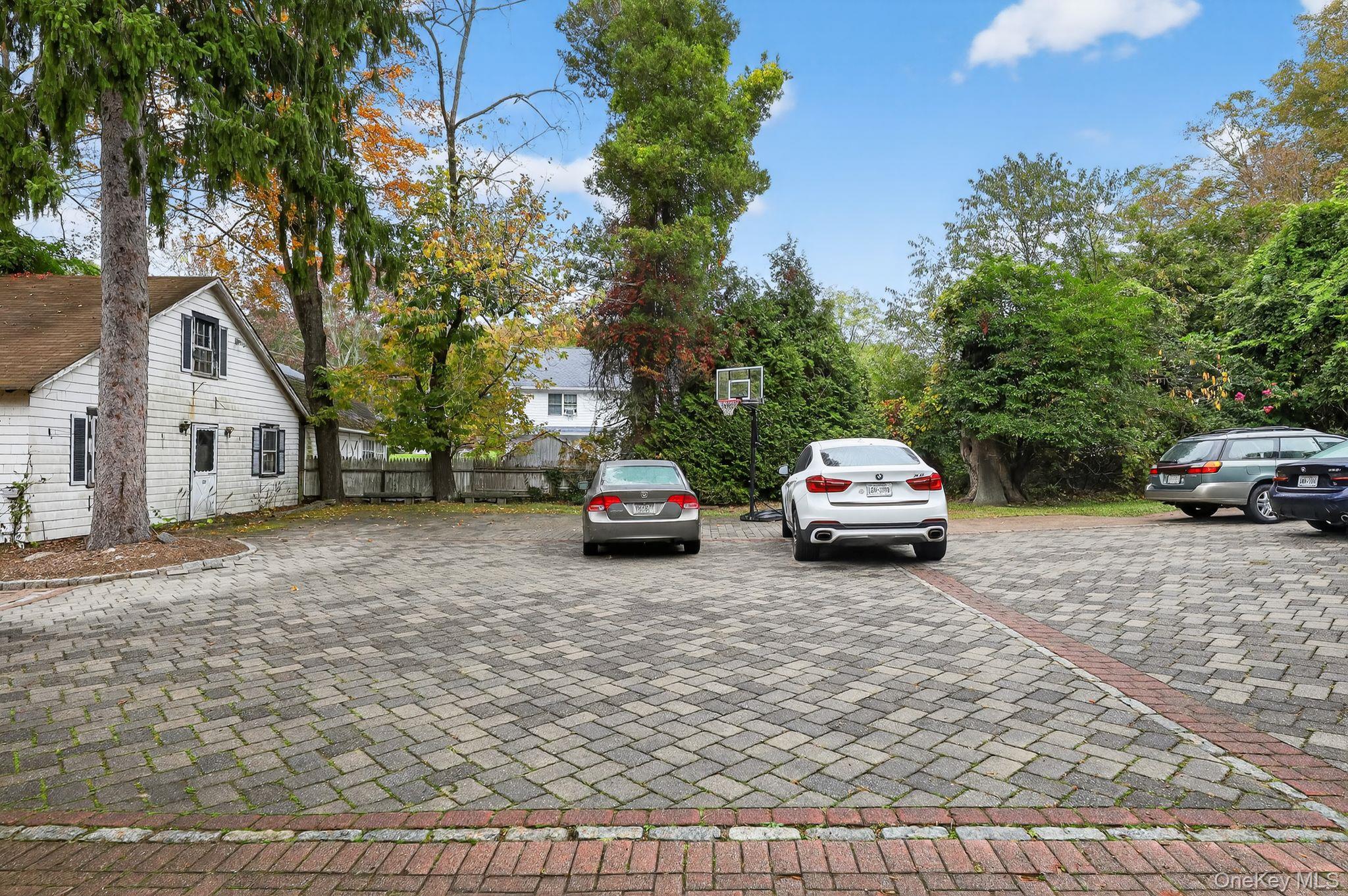 20 Old Mt Kisco Road Armonk, NY 10504 - Photo 13 of 50 a white house covered with tall trees