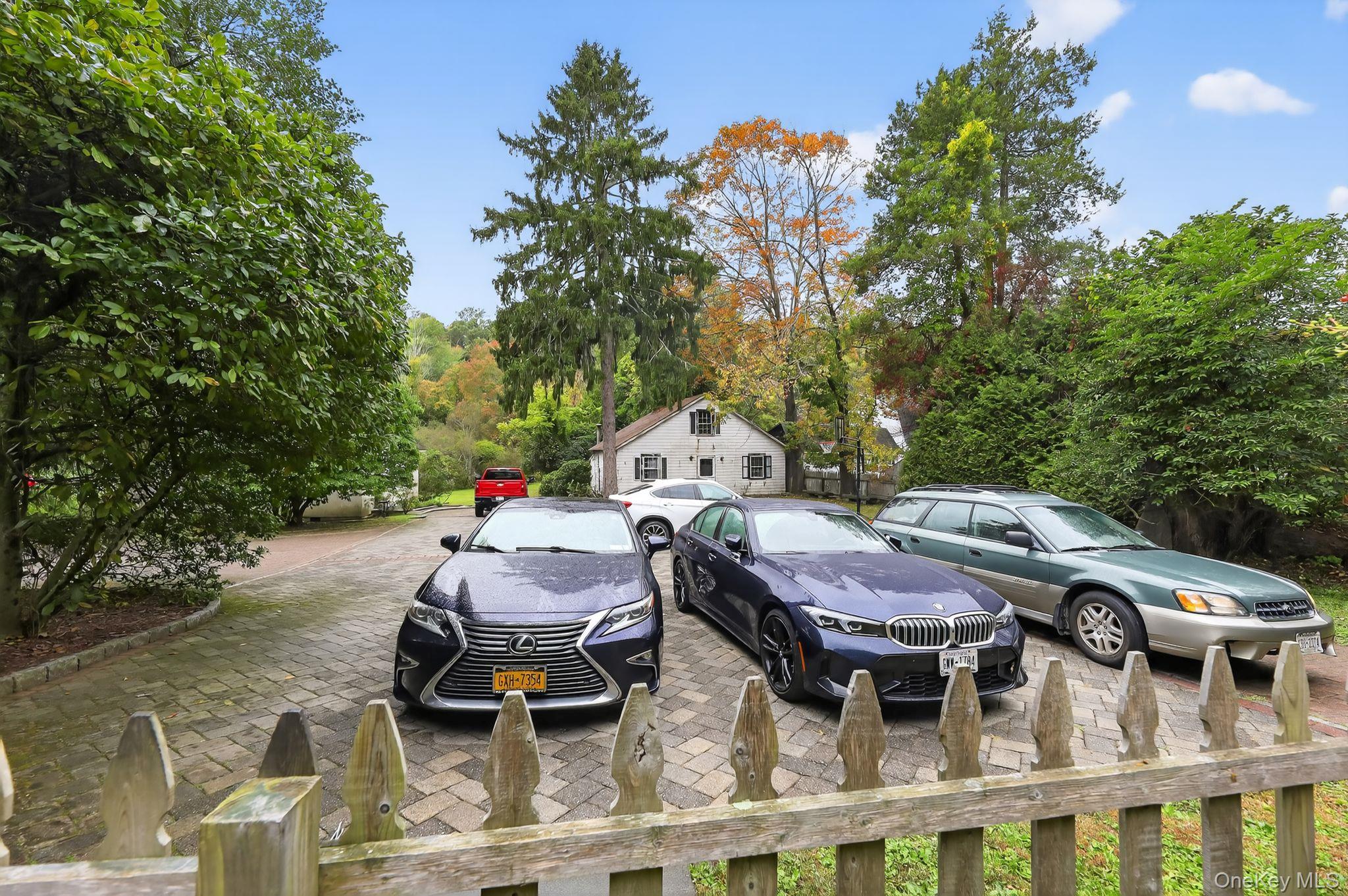 20 Old Mt Kisco Road Armonk, NY 10504 - Photo 17 of 50 a backyard of a house with table and chairs