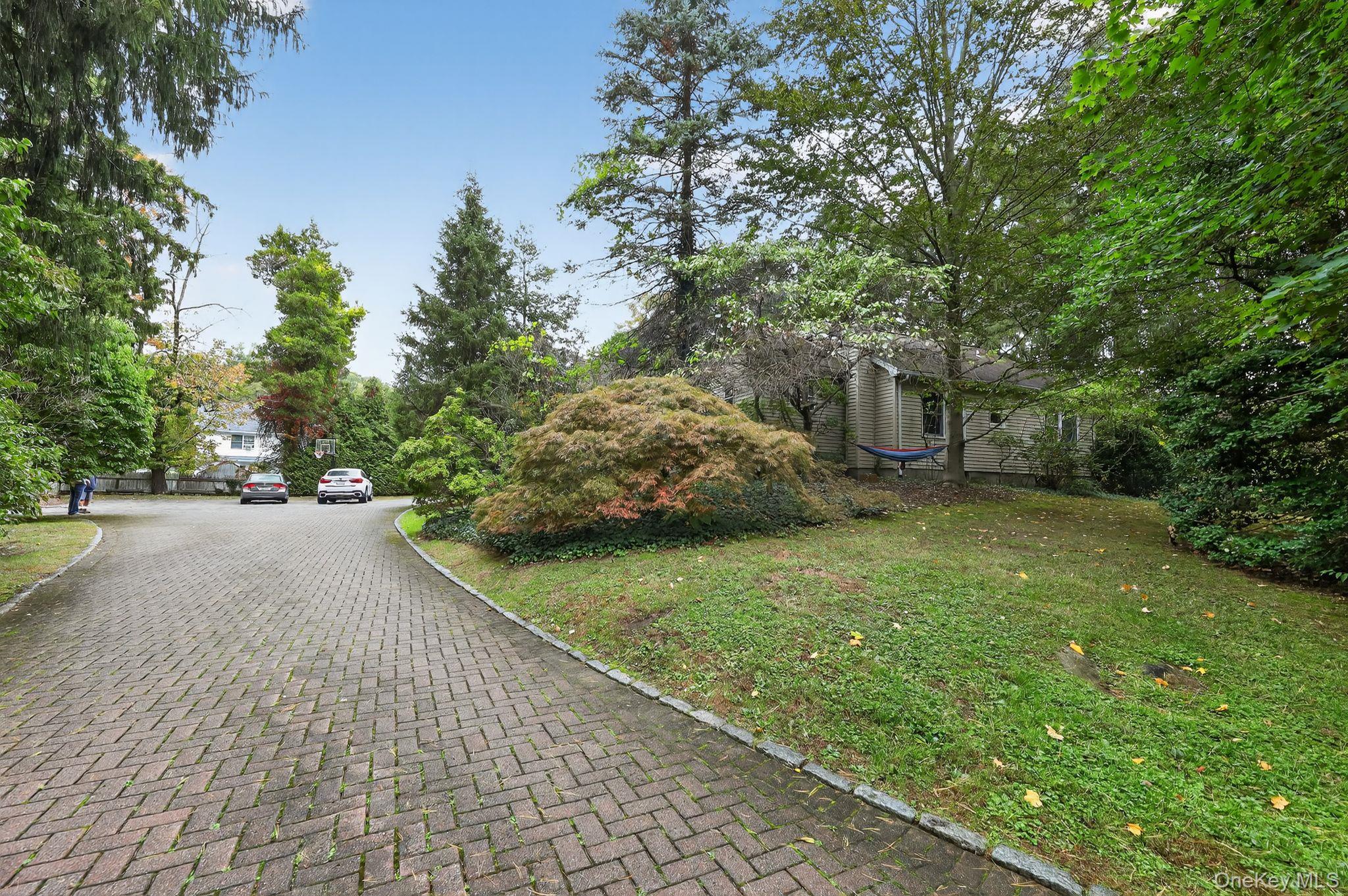 20 Old Mt Kisco Road Armonk, NY 10504 - Photo 2 of 50 a view of a street with a tree on the side of the road