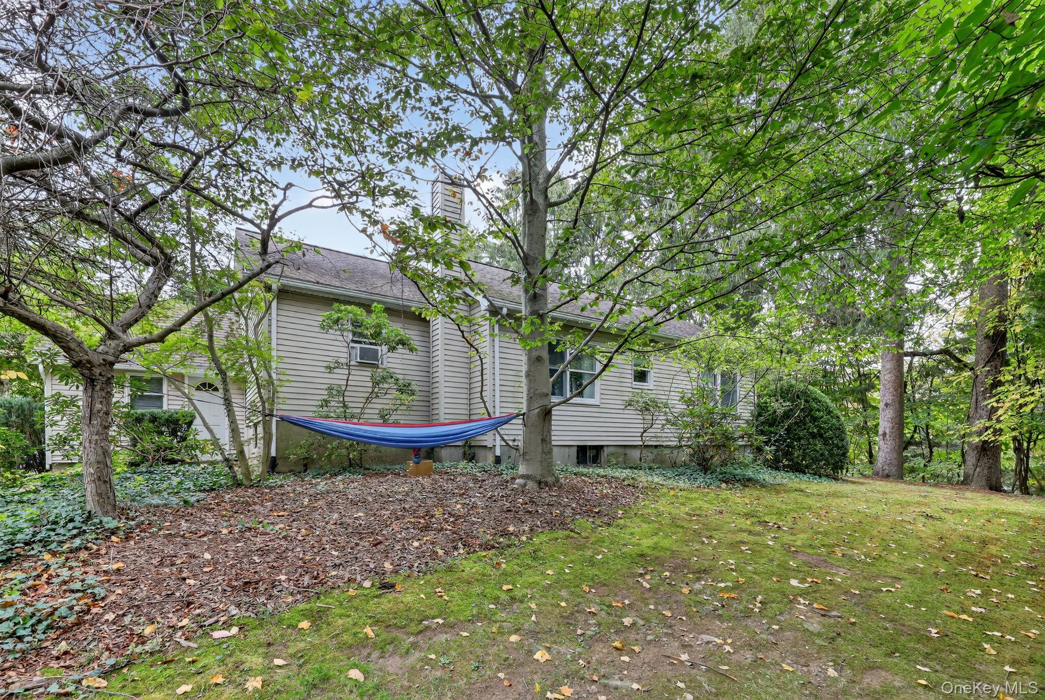 20 Old Mt Kisco Road Armonk, NY 10504 - Photo 21 of 50 a view of a backyard with large trees