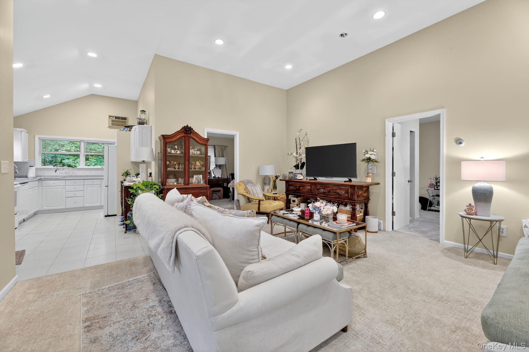 20 Old Mt Kisco Road Armonk, NY 10504 - Photo 24 of 50 a living room with furniture and a flat screen tv