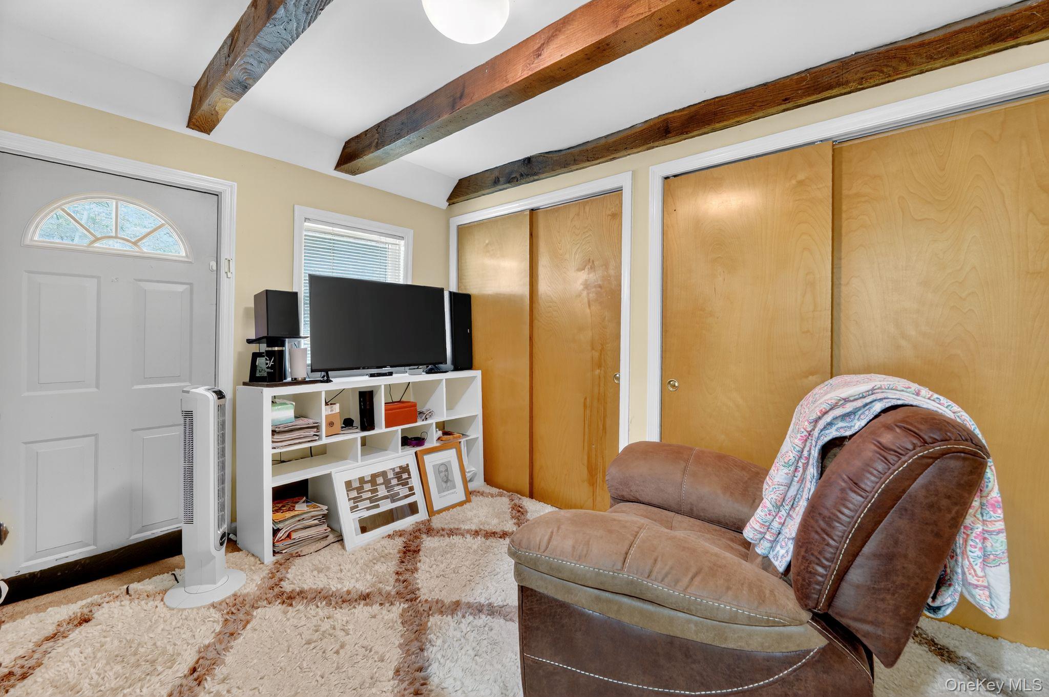 20 Old Mt Kisco Road Armonk, NY 10504 - Photo 27 of 50 a living room with furniture and a flat screen tv