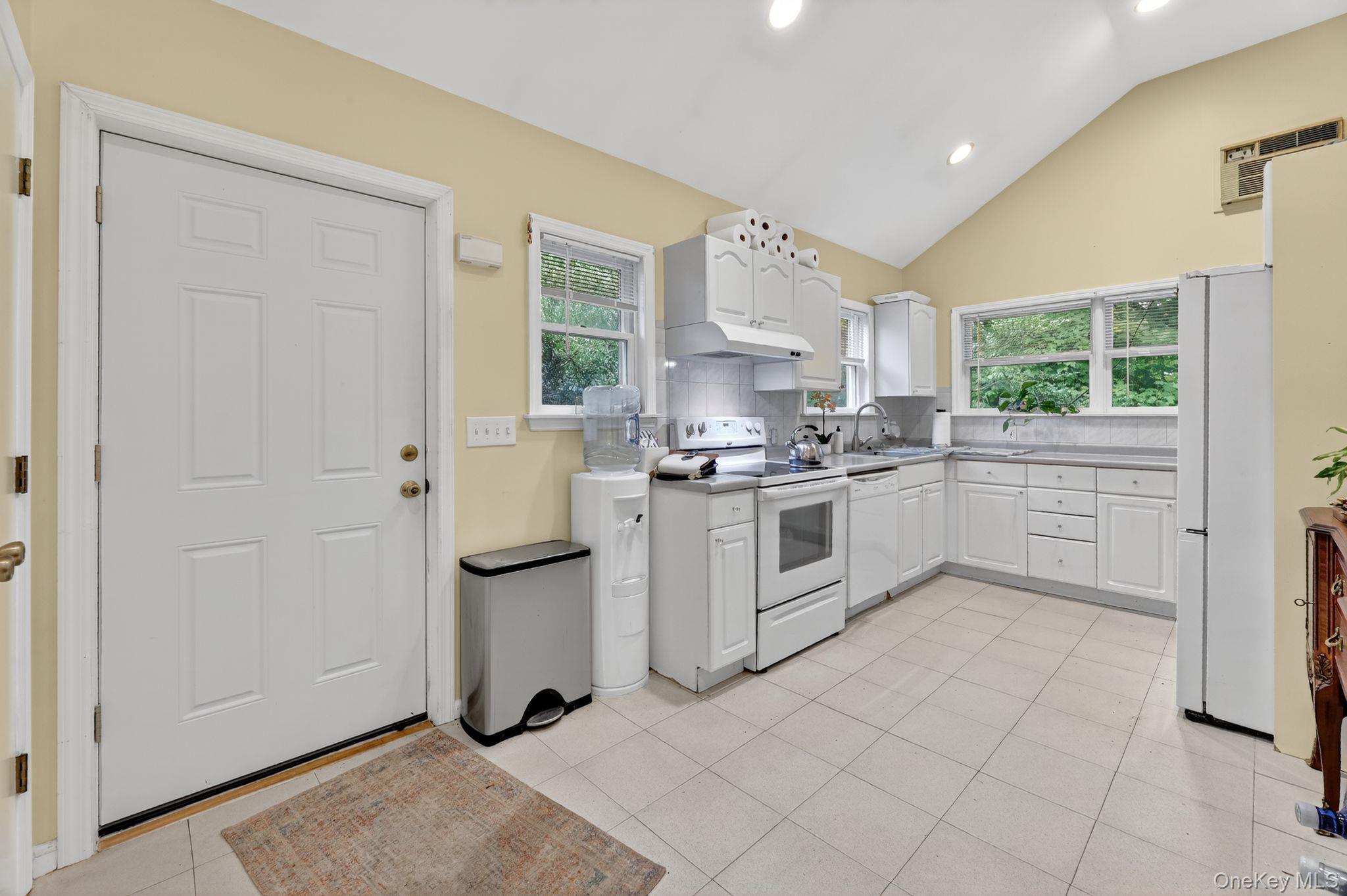 20 Old Mt Kisco Road Armonk, NY 10504 - Photo 30 of 50 a kitchen with white cabinets and white appliances
