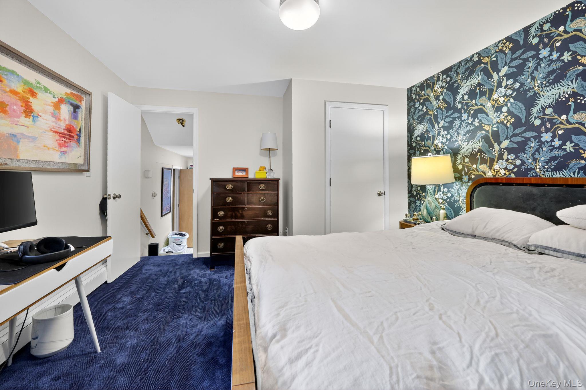 20 Old Mt Kisco Road Armonk, NY 10504 - Photo 34 of 50 a bedroom with a bed and a flat screen tv