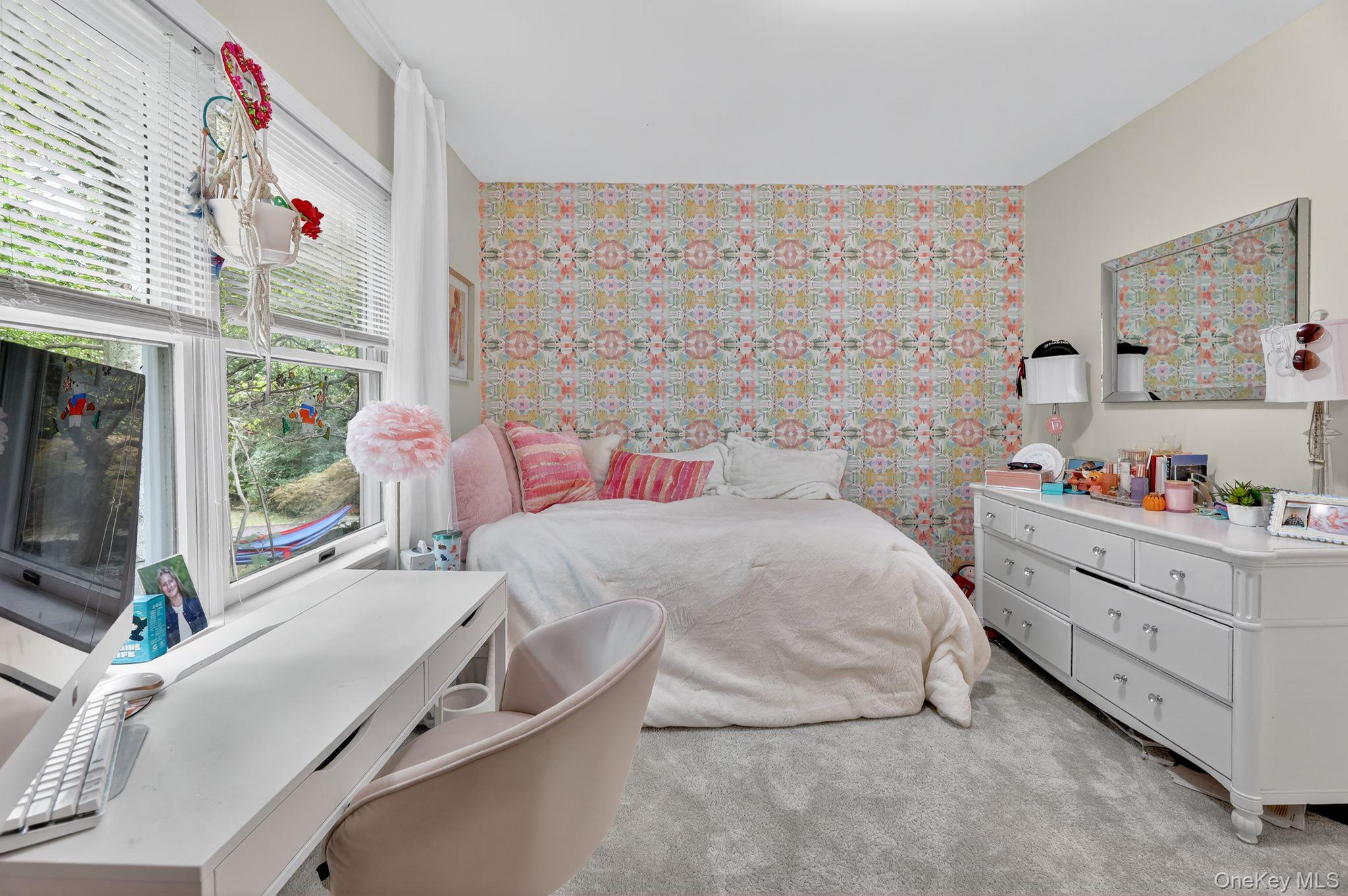 20 Old Mt Kisco Road Armonk, NY 10504 - Photo 35 of 50 a bedroom with a bed and a flat tv screen on the dresser