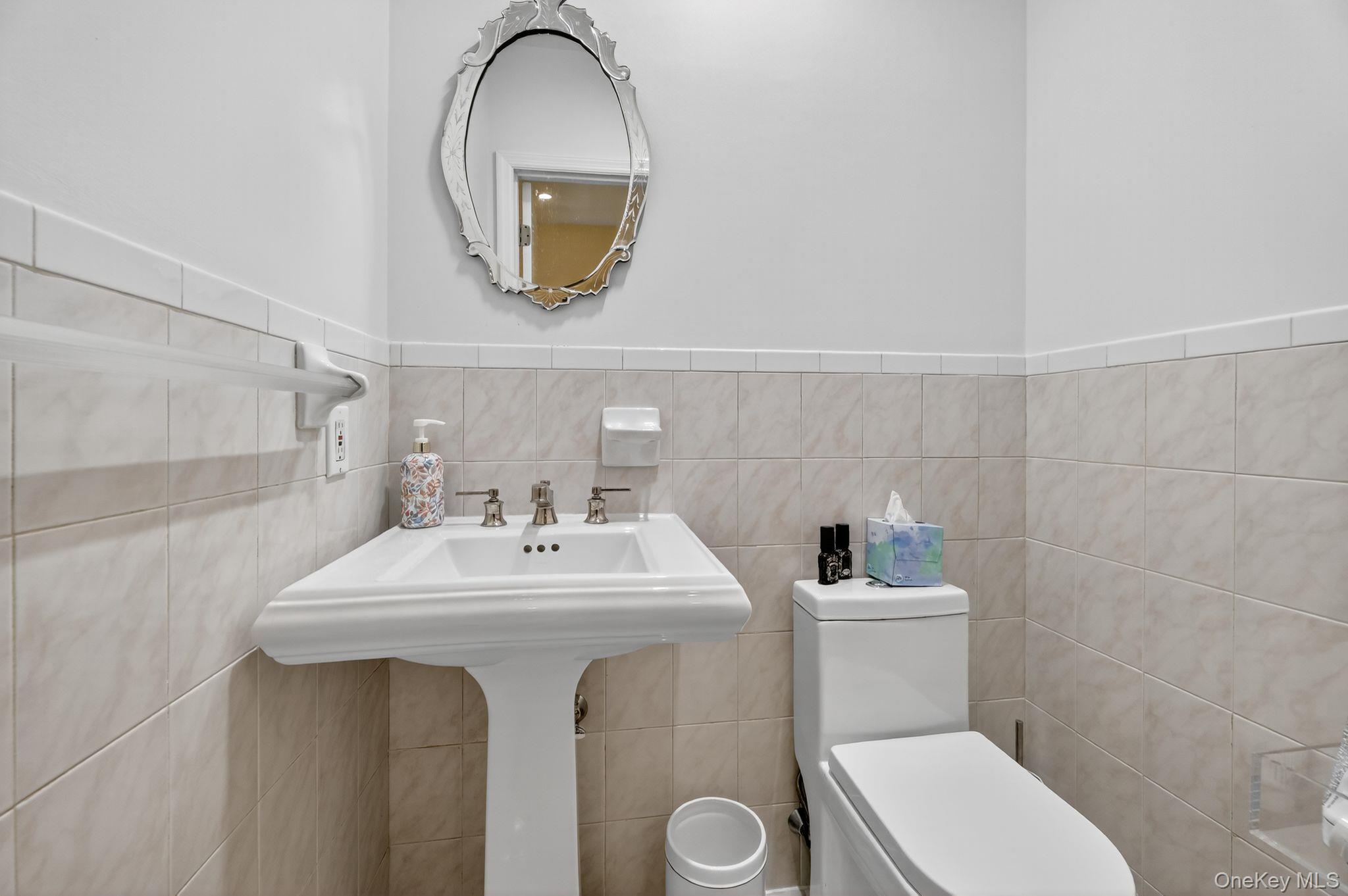 20 Old Mt Kisco Road Armonk, NY 10504 - Photo 47 of 50 a bathroom with a sink a mirror and a toilet