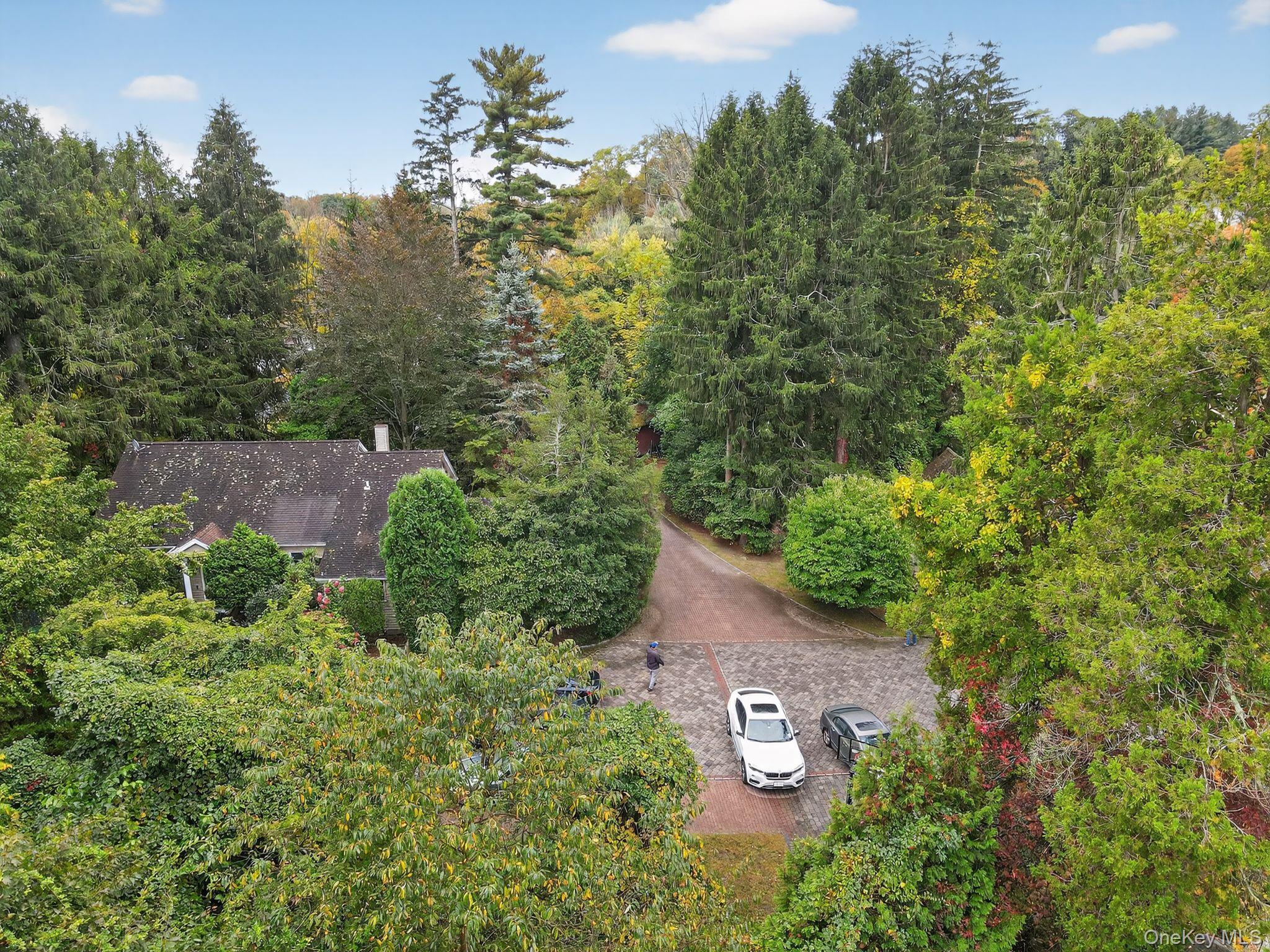 20 Old Mt Kisco Road Armonk, NY 10504 - Photo 9 of 50 an aerial view of a house with a yard and trees all around