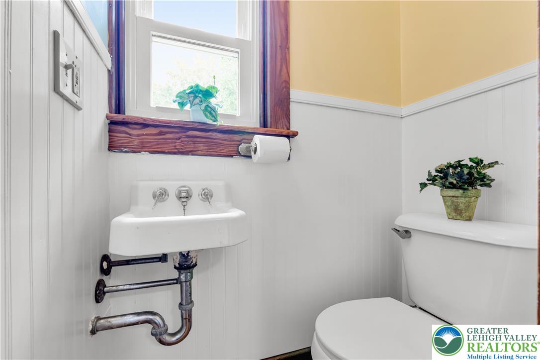 1722 Maple Street Bethlehem, PA 18017 - Photo 13 of 30 a bathroom with a sink a toilet and mirror