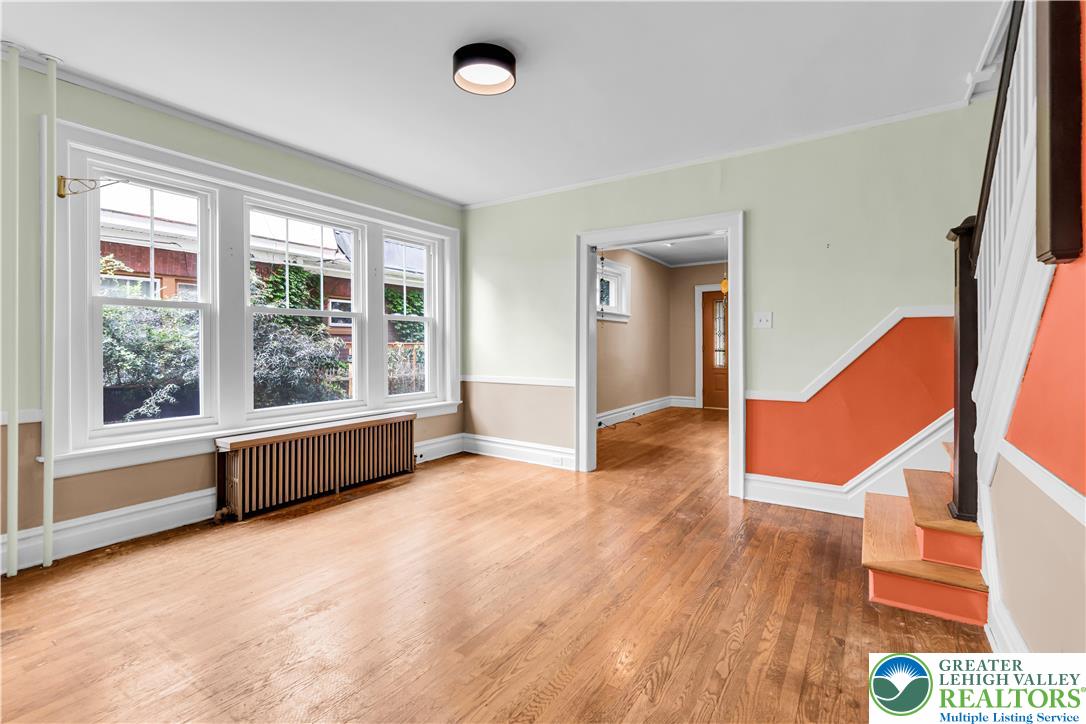 1722 Maple Street Bethlehem, PA 18017 - Photo 7 of 30 a view of an empty room with wooden floor and a window
