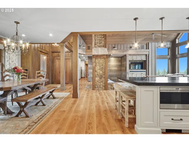 a kitchen with stainless steel appliances kitchen island granite countertop a sink and cabinets