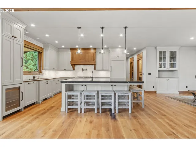a kitchen with stainless steel appliances granite countertop a stove and a sink