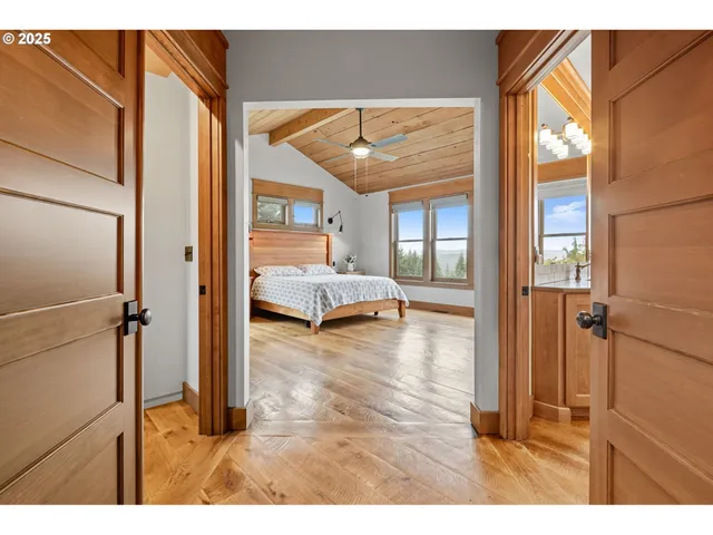 a spacious bathroom with a granite countertop sink a mirror and a bathtub