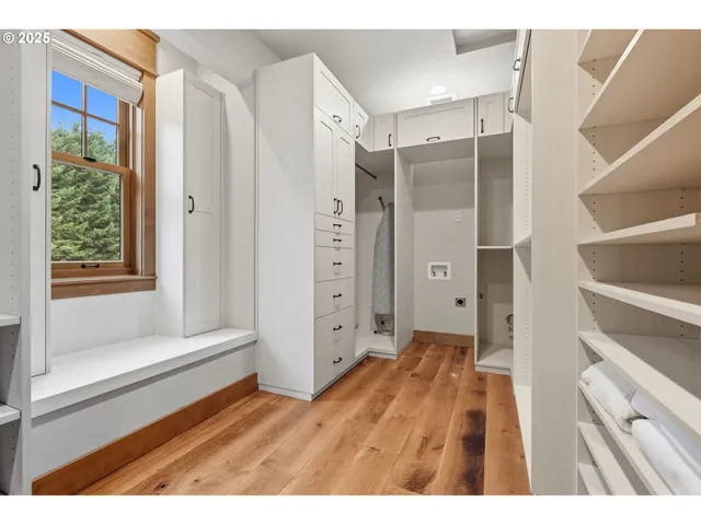 a bathroom with a granite countertop sink a mirror and a shower