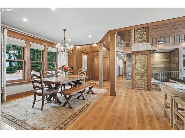 a large kitchen with stainless steel appliances kitchen island granite countertop a large stove a sink and a refrigerator