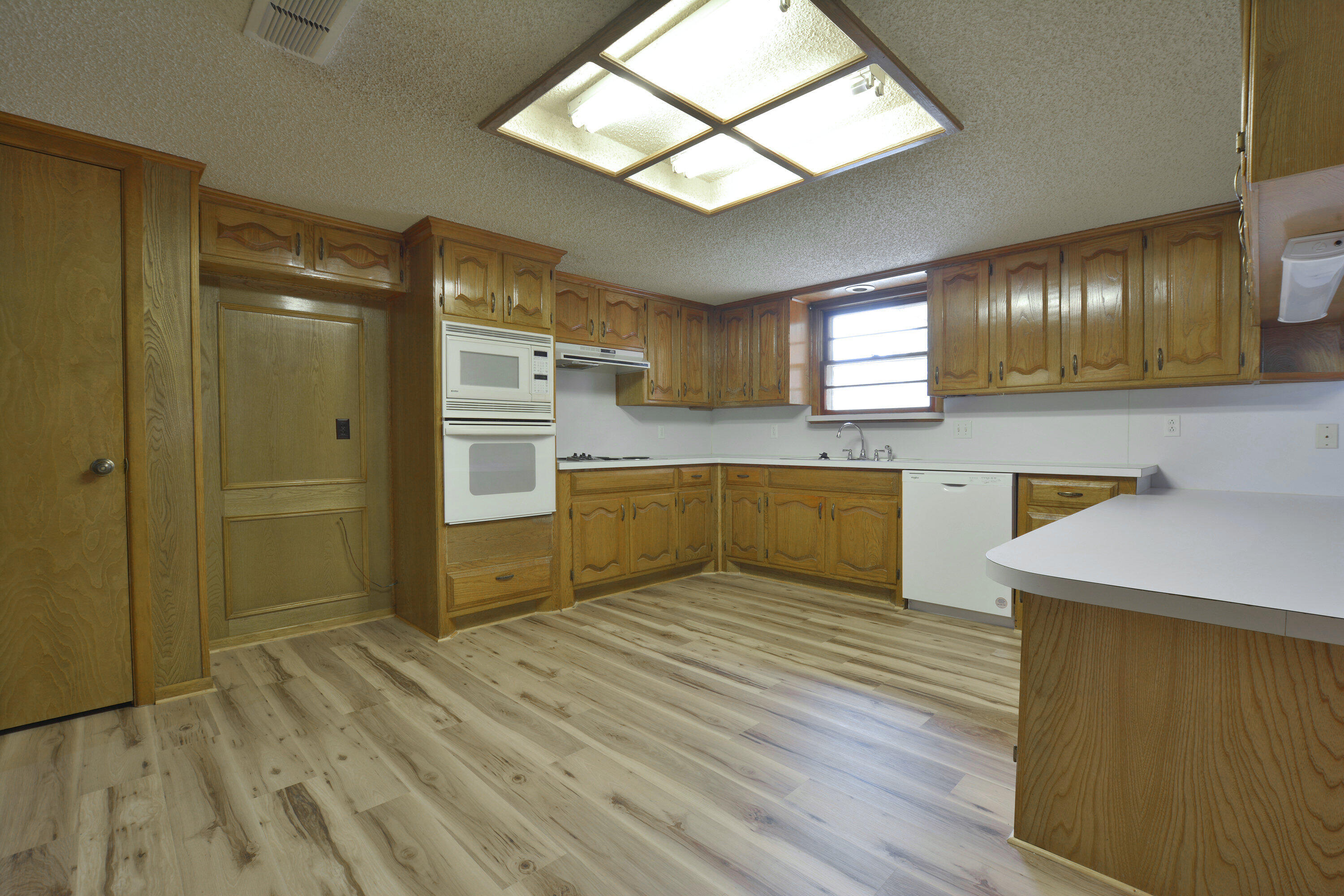 5224 9th Street Lubbock, TX 79416 - Photo 13 of 26 a view of a kitchen with a sink and dishwasher kitchen view