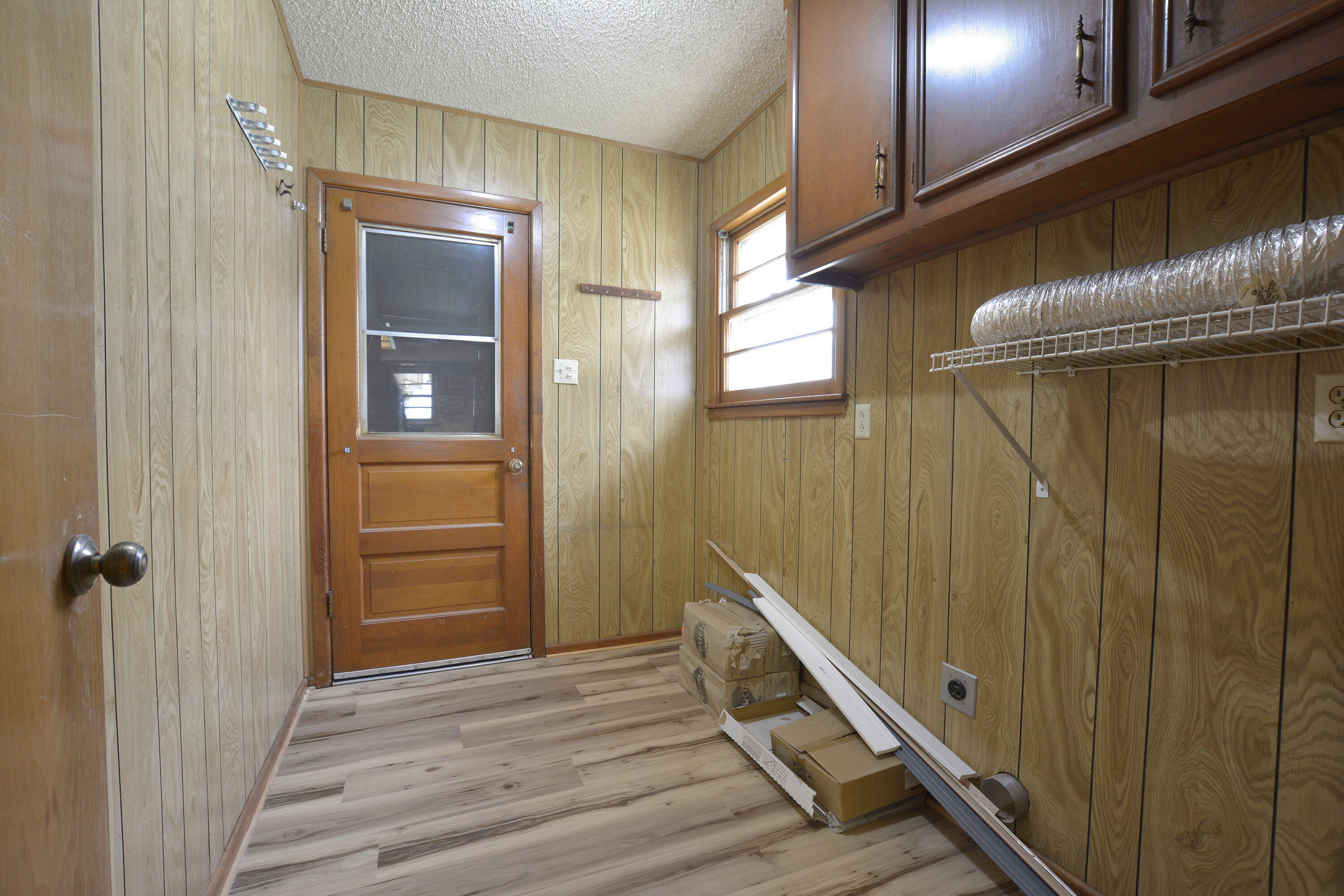 5224 9th Street Lubbock, TX 79416 - Photo 15 of 26 a view of a hallway with wooden floor and staircase