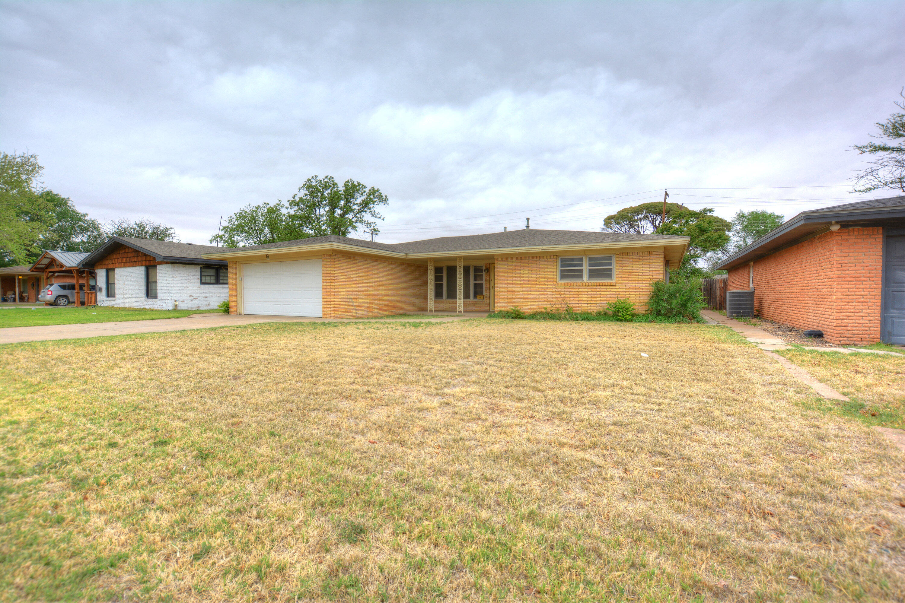 5224 9th Street Lubbock, TX 79416 - Photo 2 of 26 a front view of house with yard