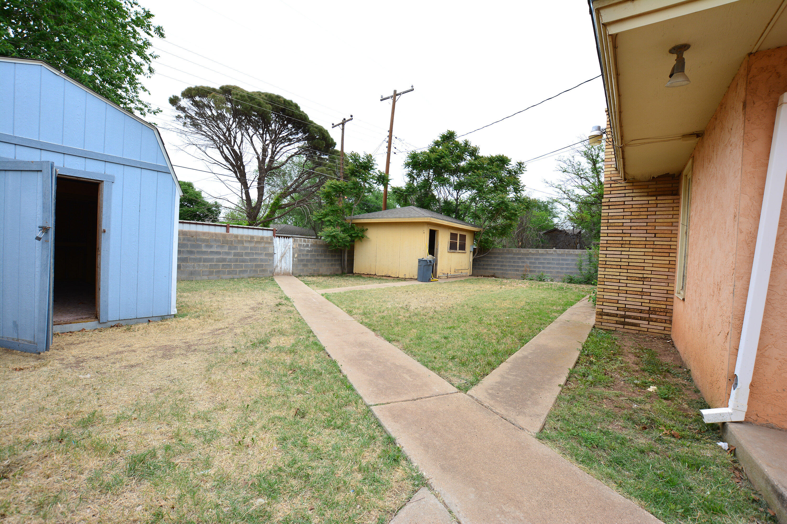 5224 9th Street Lubbock, TX 79416 - Photo 23 of 26 a view of front door and yard