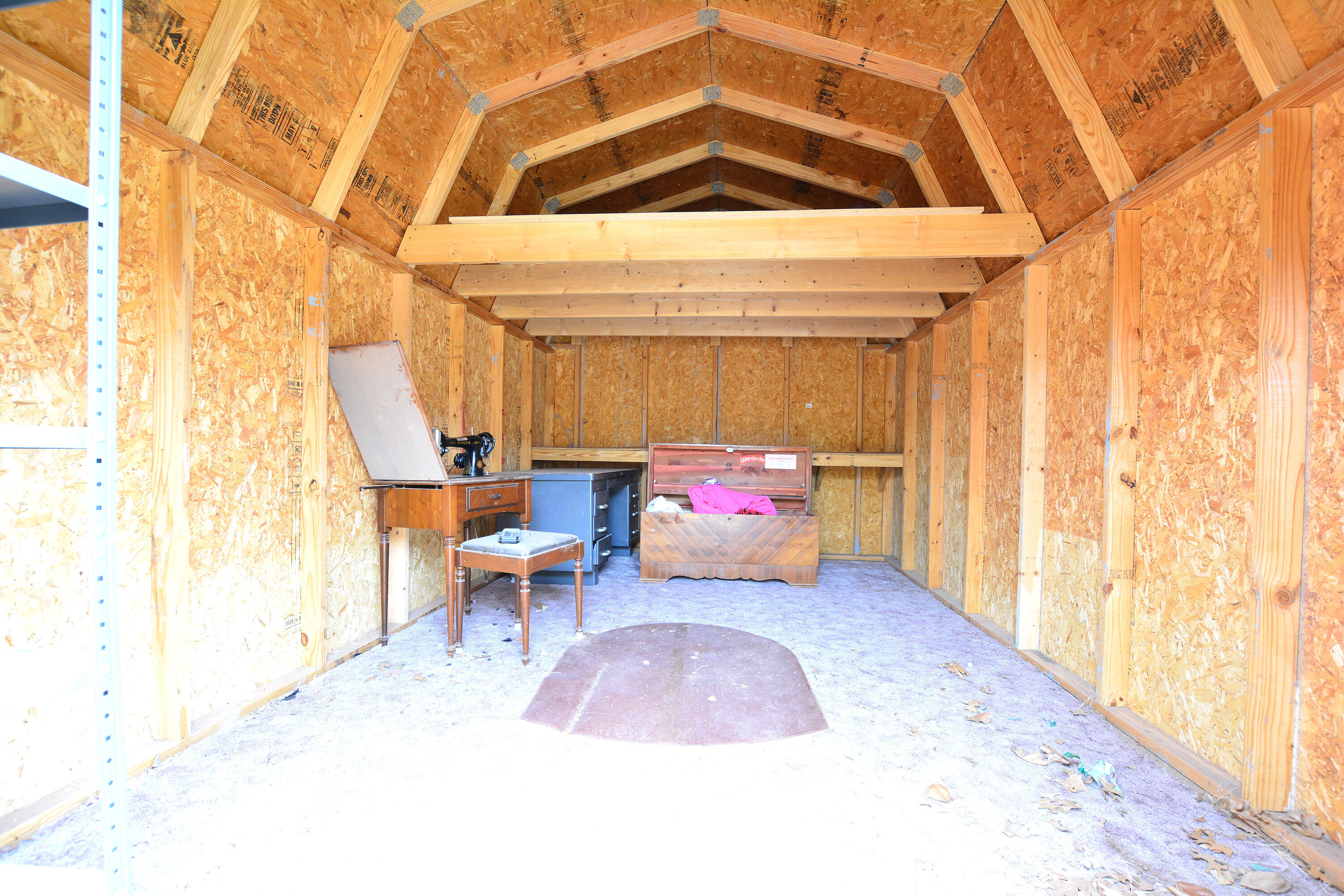 5224 9th Street Lubbock, TX 79416 - Photo 24 of 26 a bed room with a bed and a chair