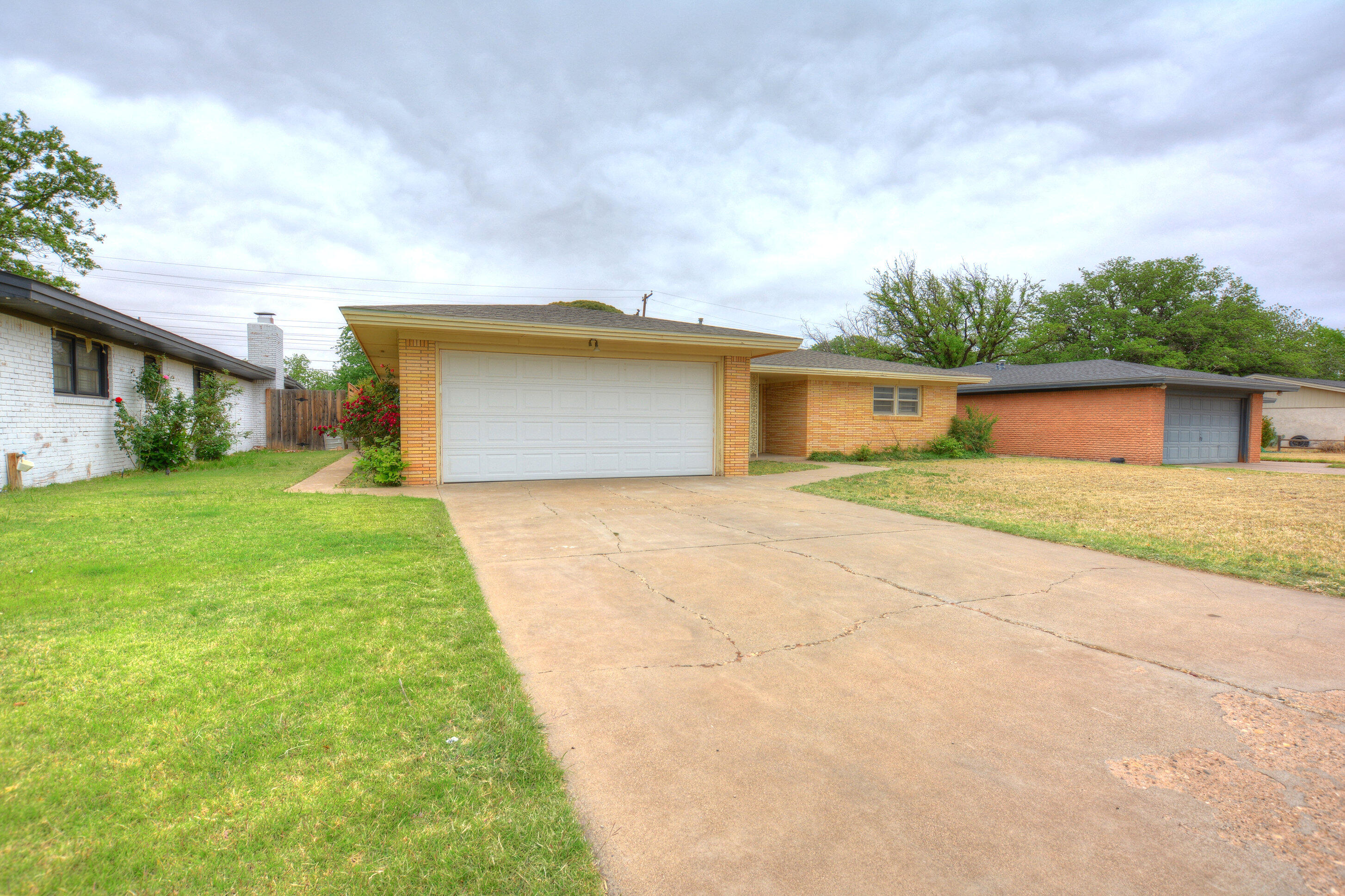 5224 9th Street Lubbock, TX 79416 - Photo 3 of 26 a front view of house with yard and green space