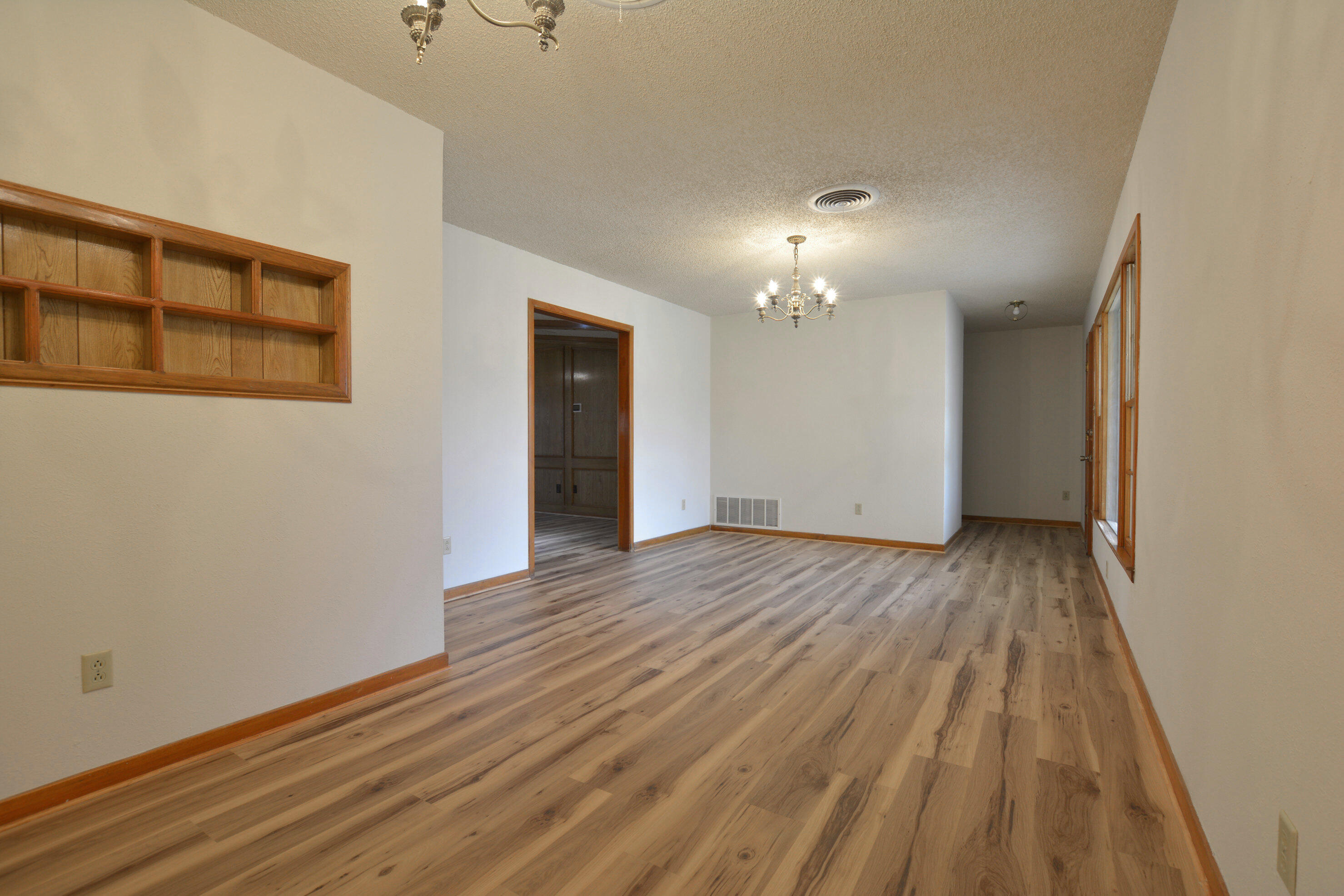 5224 9th Street Lubbock, TX 79416 - Photo 6 of 26 a view of a livingroom with wooden floor