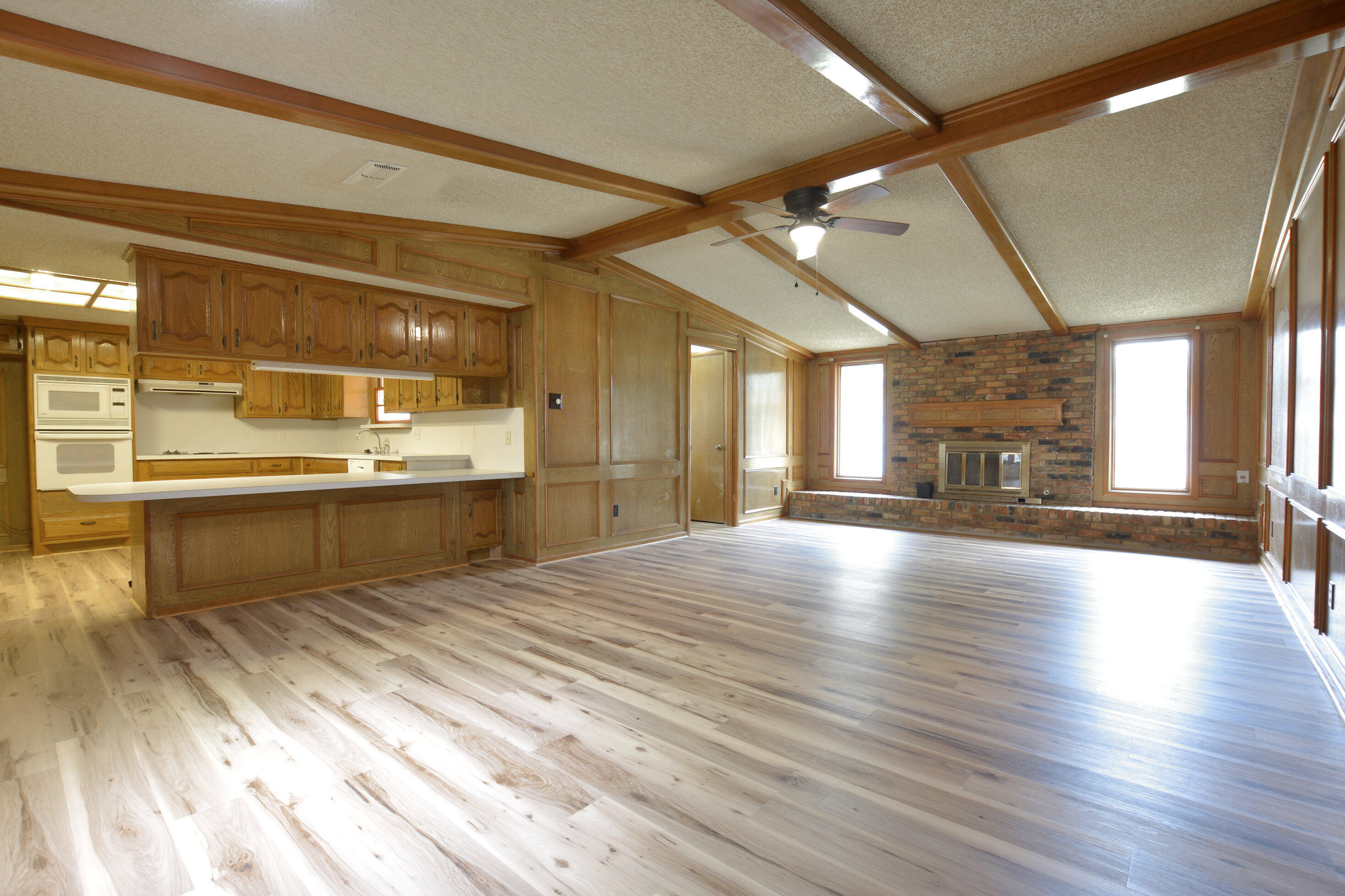 5224 9th Street Lubbock, TX 79416 - Photo 7 of 26 a large white kitchen with a large window