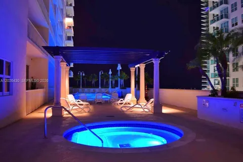 a living room with furniture a ceiling fan and a window