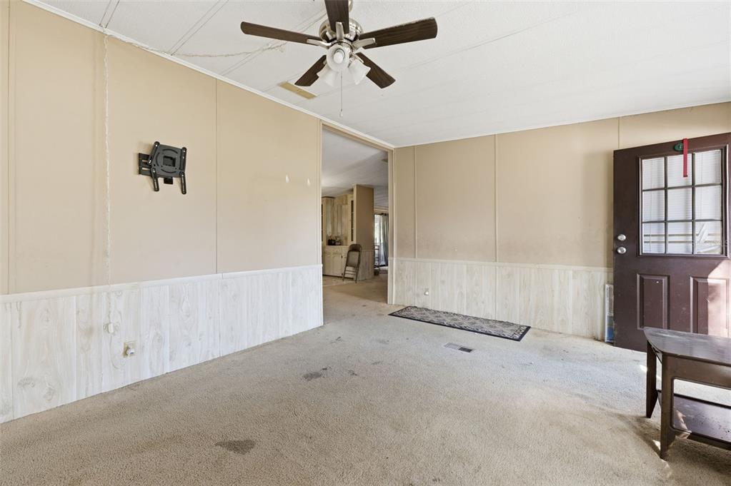 8045 Indian Trail Road Weeki Wachee, FL 34613 - Photo 29 of 49 a view of a livingroom with a furniture and entryway