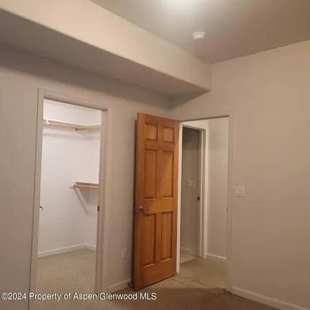 an empty room with an empty space and window
