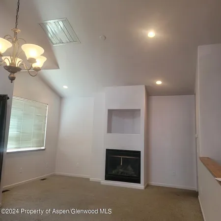 a view of a livingroom with a fireplace