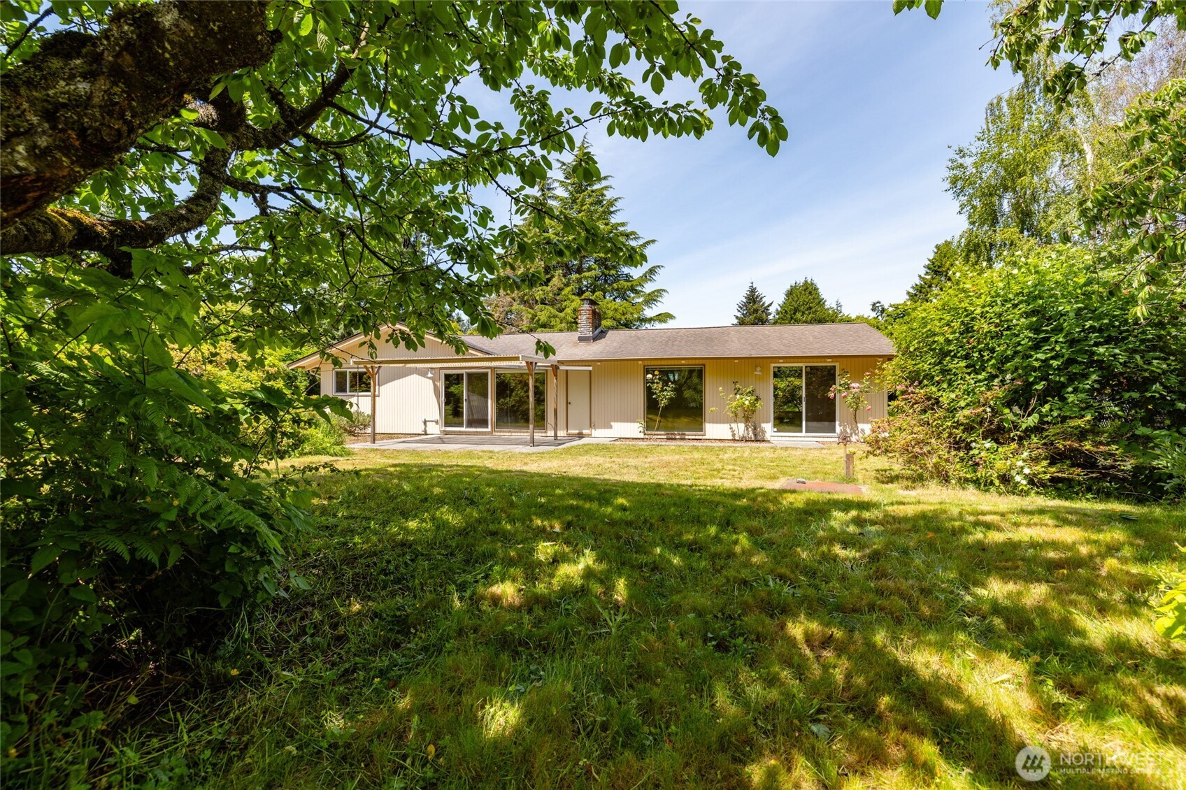 21316 Rolling Ridge Drive Sedro-Woolley, WA 98284 - Photo 29 of 37 a front view of a house with a garden