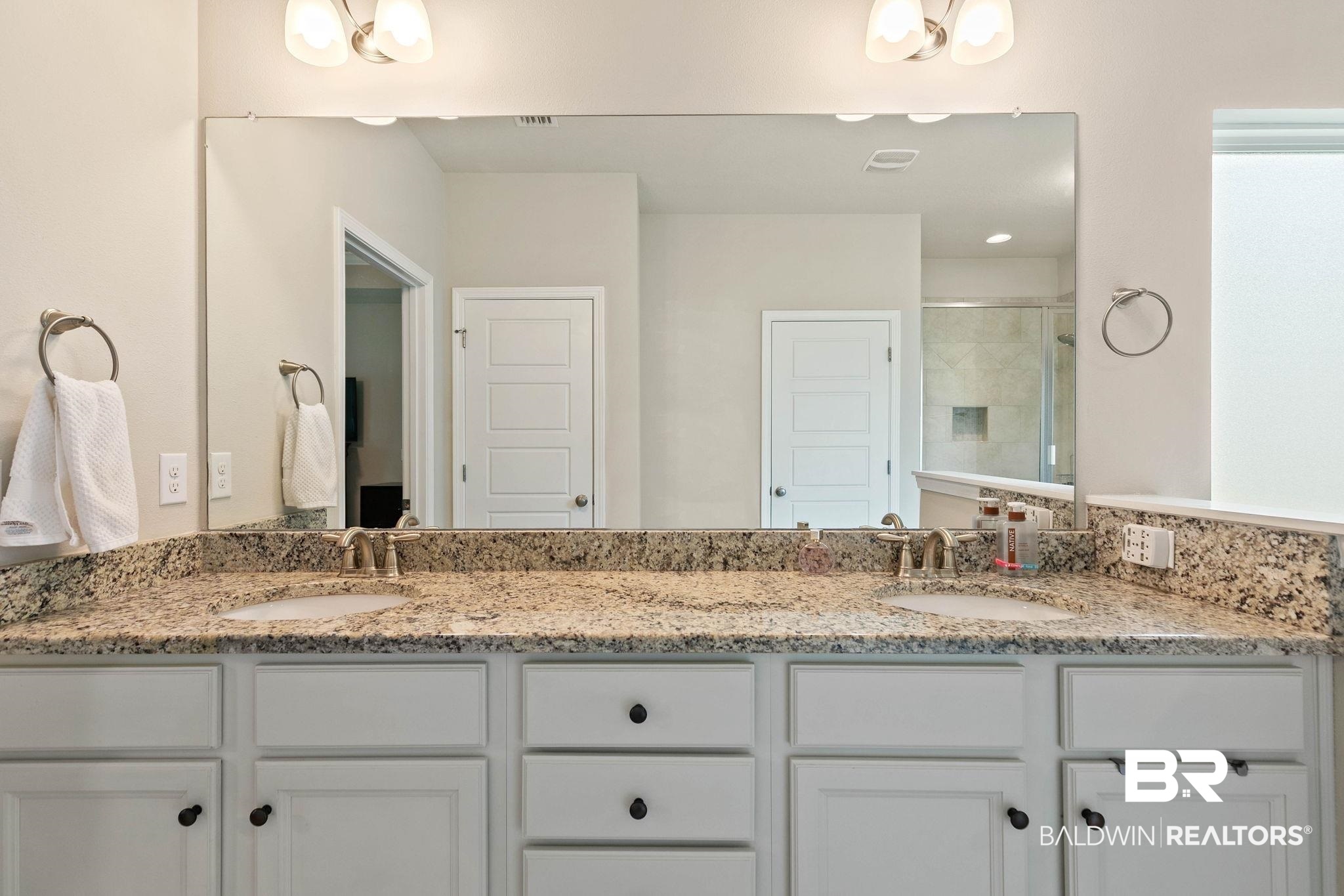 12750 B Jenkins Pit Road Daphne, AL 36527 - Photo 35 of 89 Bathroom featuring double vanity and a stall shower
