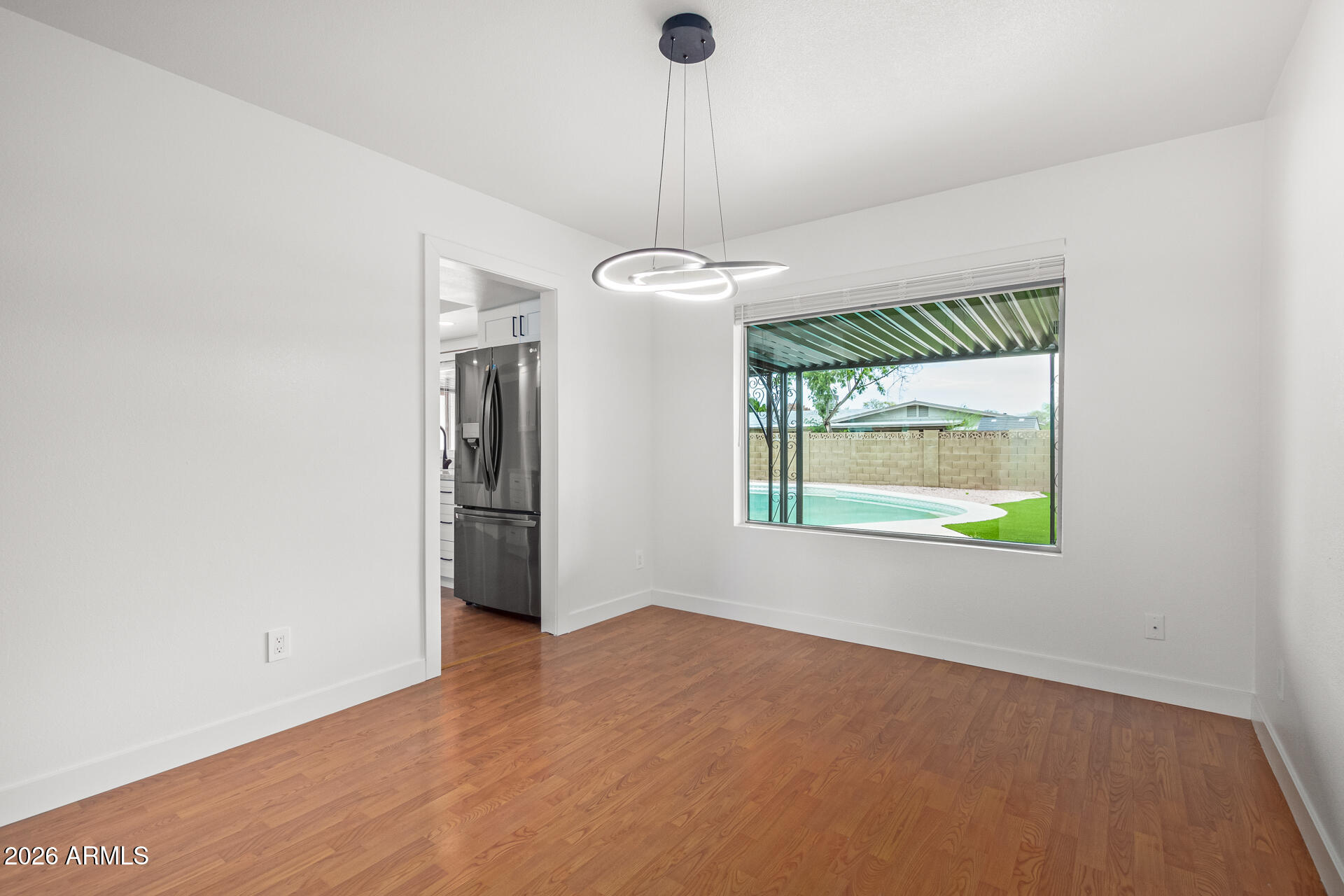 2111 South River Drive Tempe, AZ 85282 - Photo 9 of 26 a view of an empty room with a window