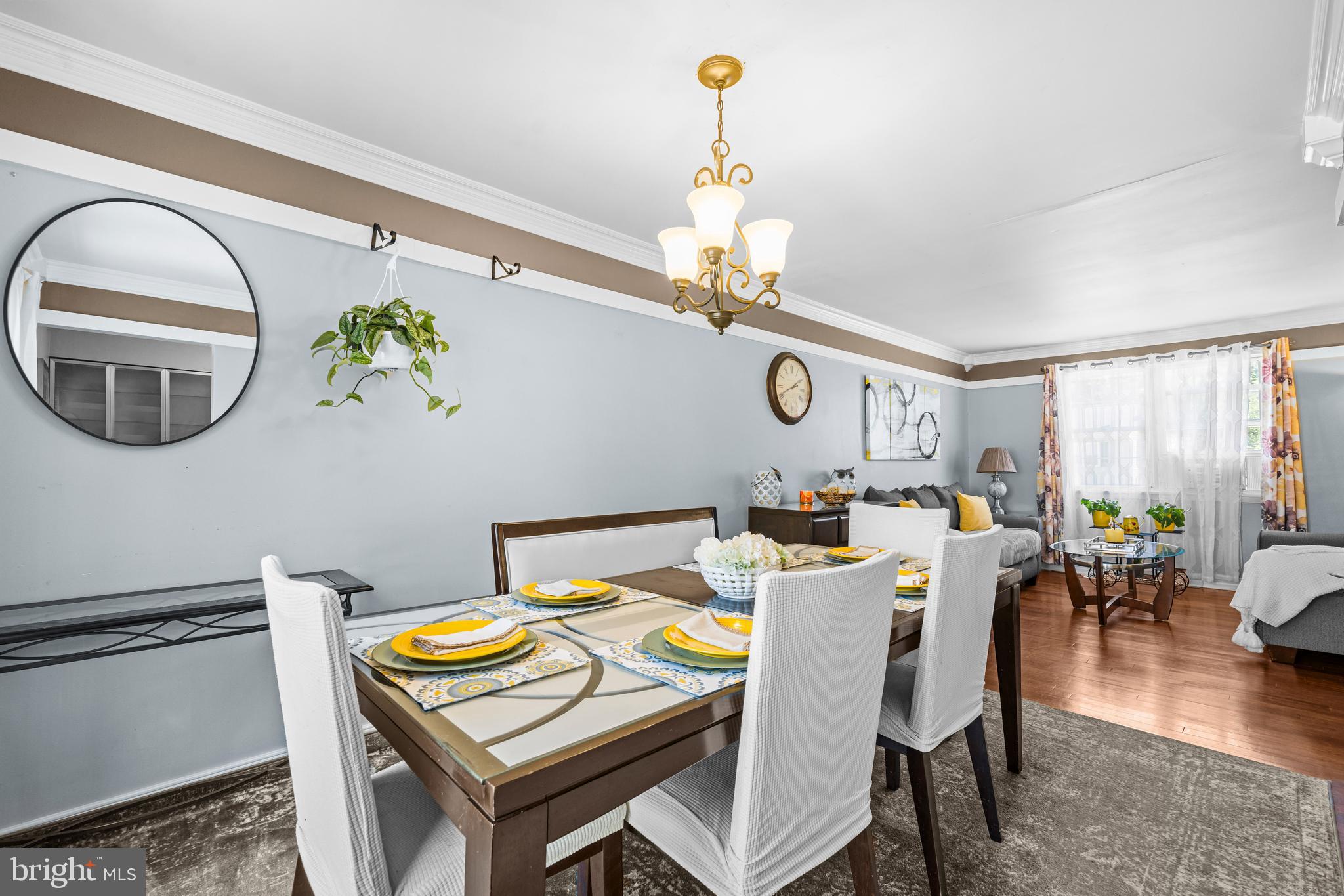 236 Inlet Drive Pasadena, MD 21122 - Photo 7 of 33 a view of a dining room with furniture window and wooden floor