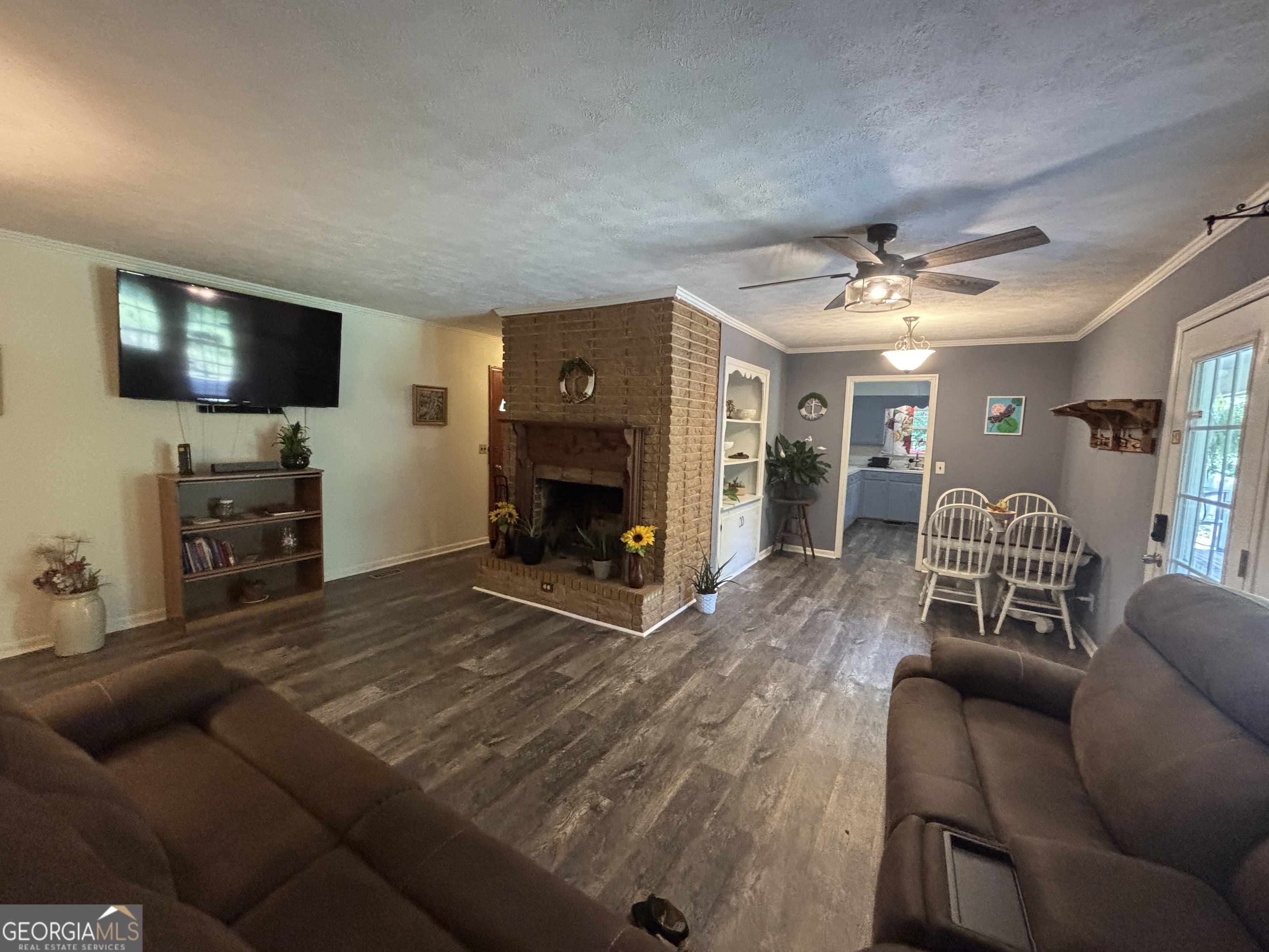 152 Crest Drive Cochran, GA 31014 - Photo 18 of 54 a living room with furniture and a flat screen tv