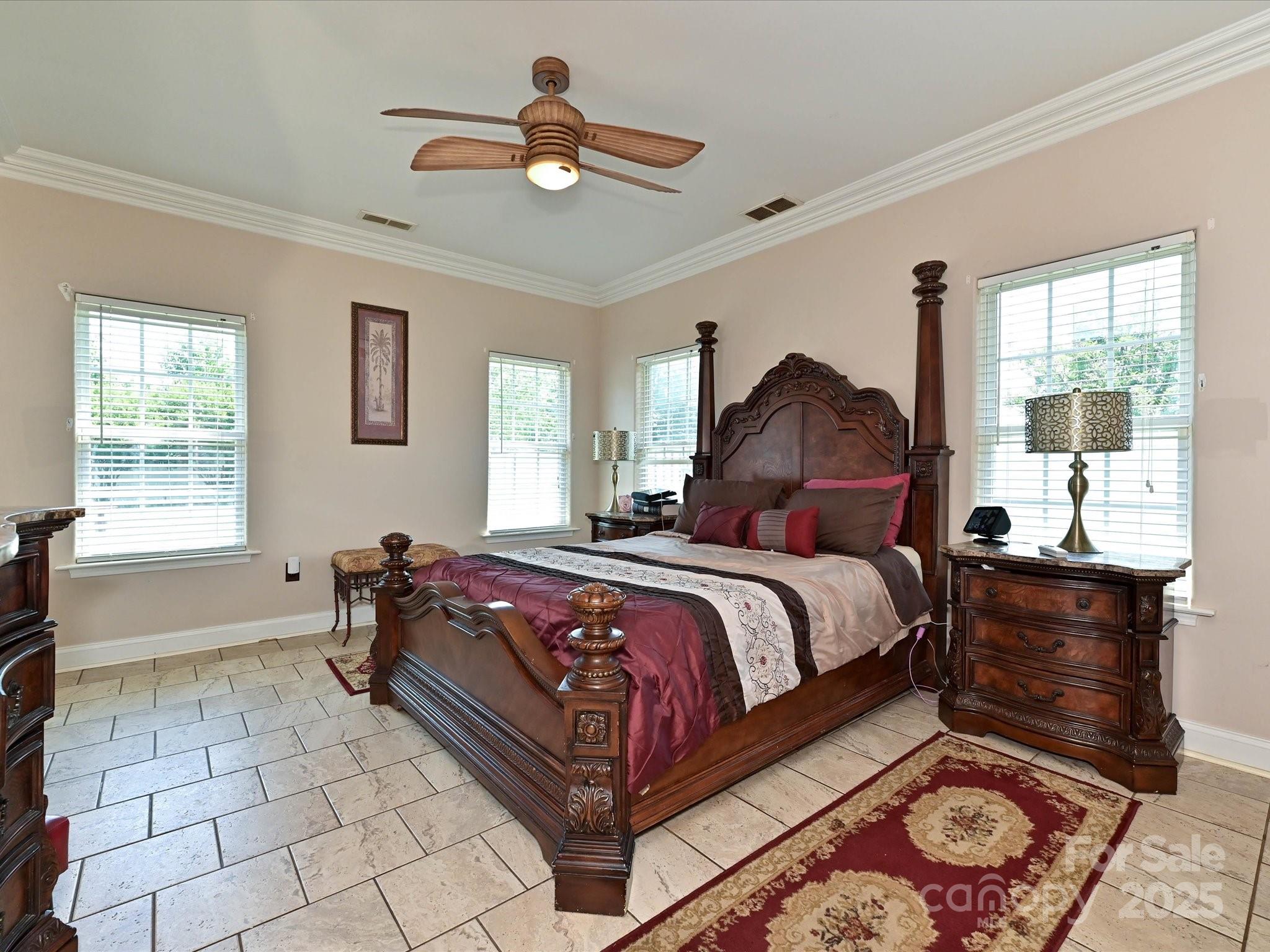 4562 Lanstone Court Southwest Concord, NC 28027 - Photo 11 of 30 a bedroom with a bed and window
