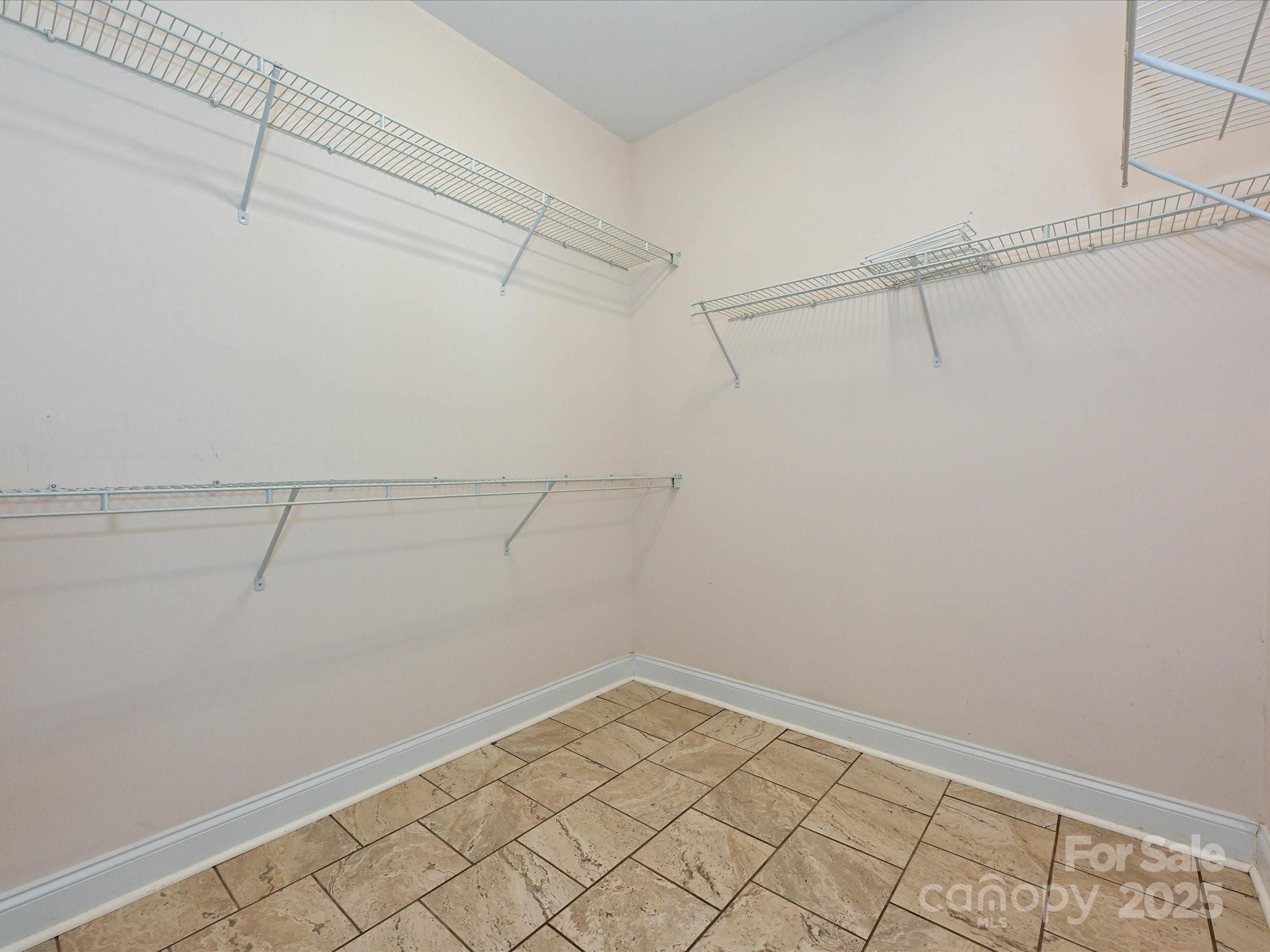 4562 Lanstone Court Southwest Concord, NC 28027 - Photo 14 of 30 a view of a room with racks on the wall
