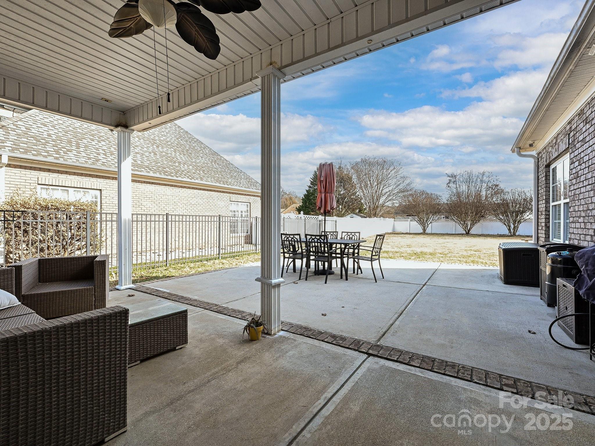 4562 Lanstone Court Southwest Concord, NC 28027 - Photo 16 of 30 a view of a swimming pool with a patio