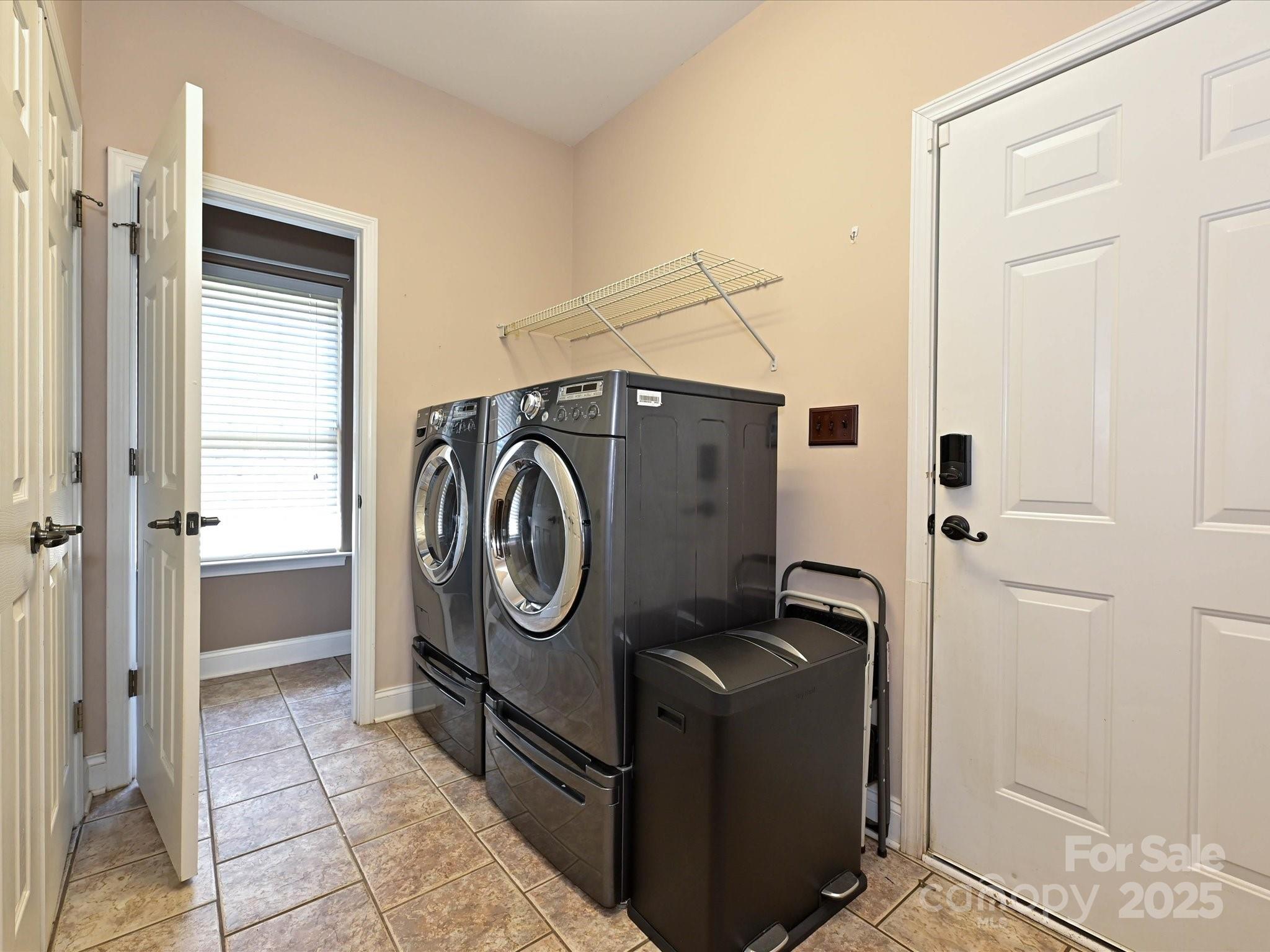 4562 Lanstone Court Southwest Concord, NC 28027 - Photo 17 of 30 a utility room with dryer and washer