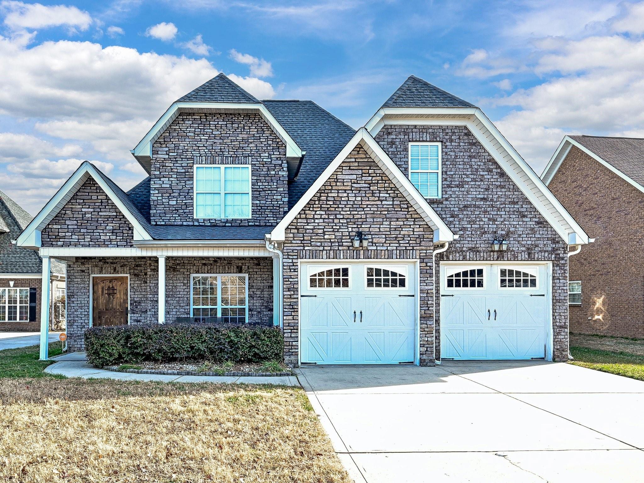 4562 Lanstone Court Southwest Concord, NC 28027 - Photo 2 of 30 a front view of a house with a yard