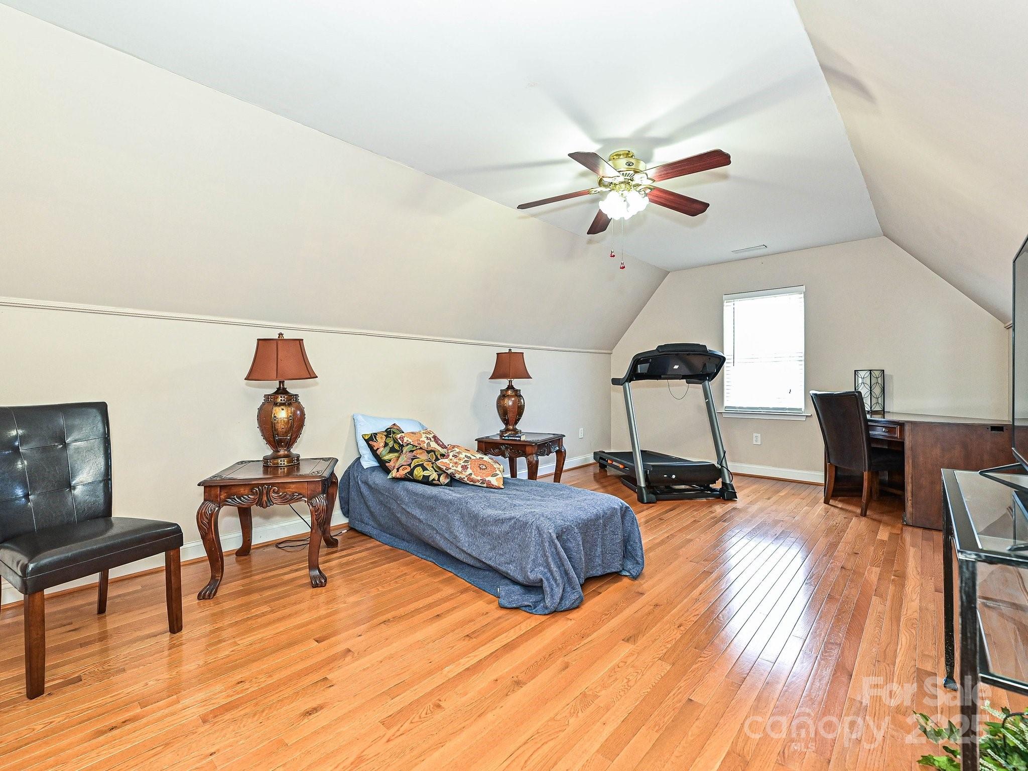 4562 Lanstone Court Southwest Concord, NC 28027 - Photo 22 of 30 a living room with furniture and wooden floor