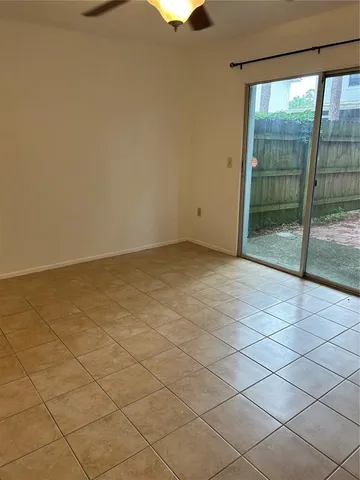 a view of an empty room and a window