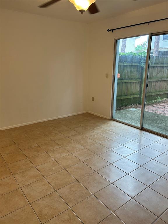 3936 Southwest 26th Terrace, Unit B Gainesville, FL 32608 - Photo 6 of 15 a view of an empty room and a window