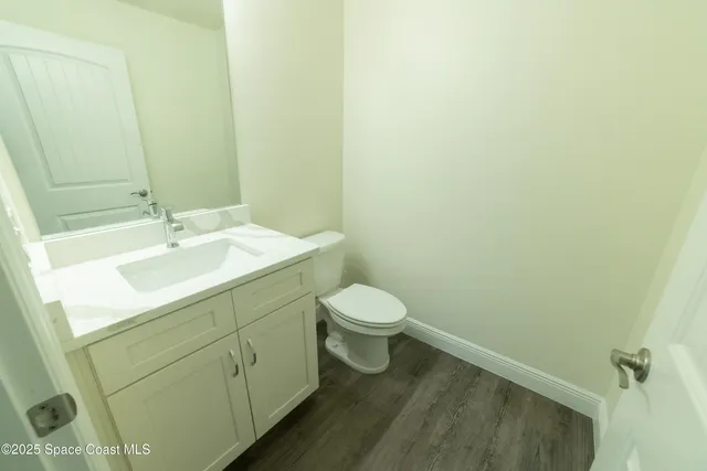 a bathroom with a sink toilet and vanity