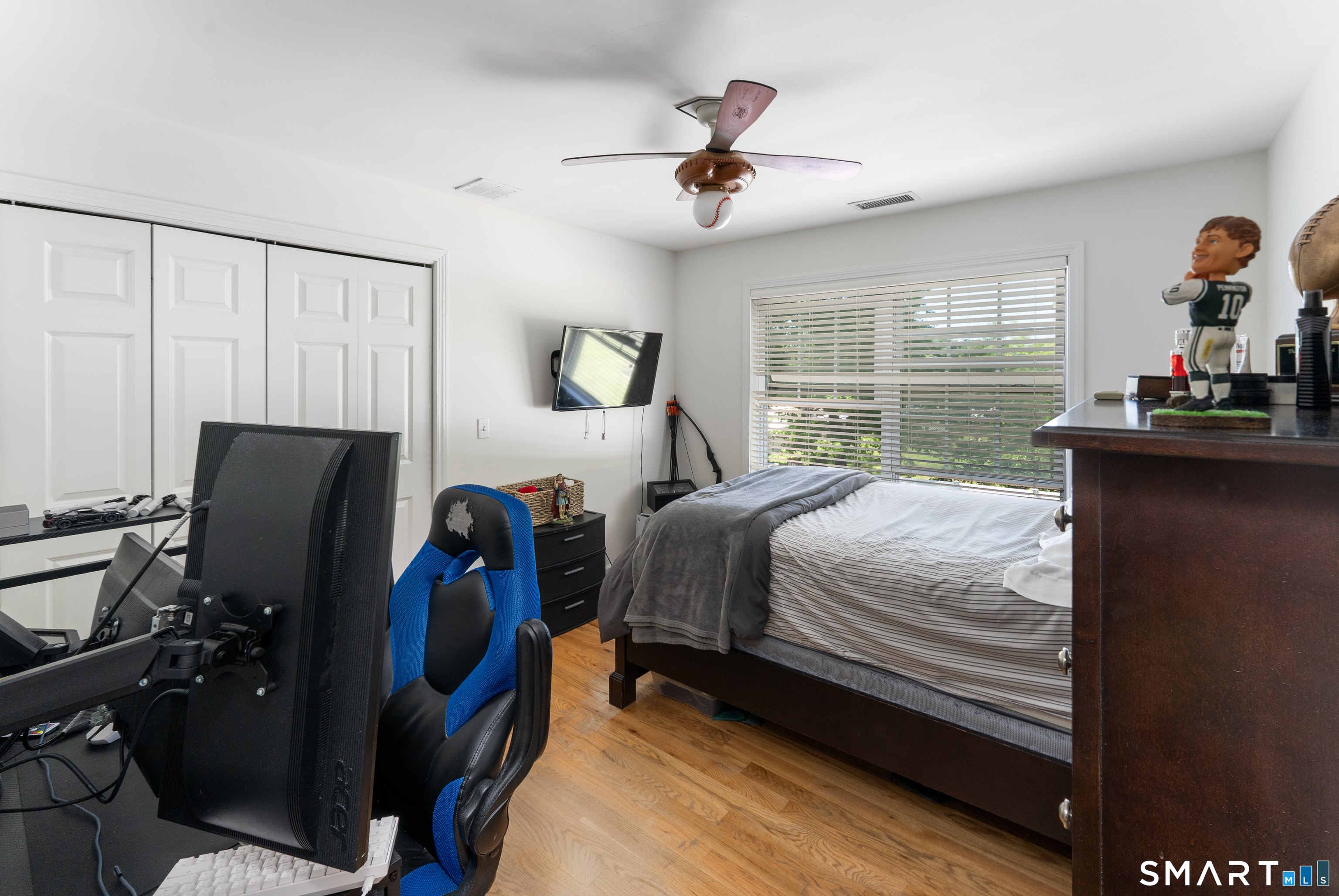 261 Spring Road North Haven, CT 06473 - Photo 38 of 39 a bedroom with a bed and a chandelier