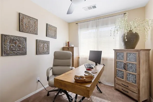 a work room with furniture and a window