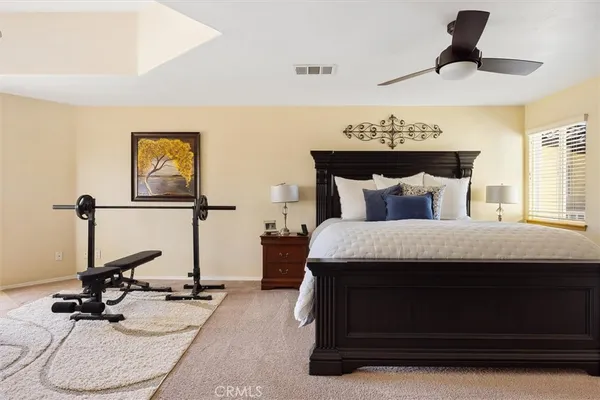 a bedroom with bed and window